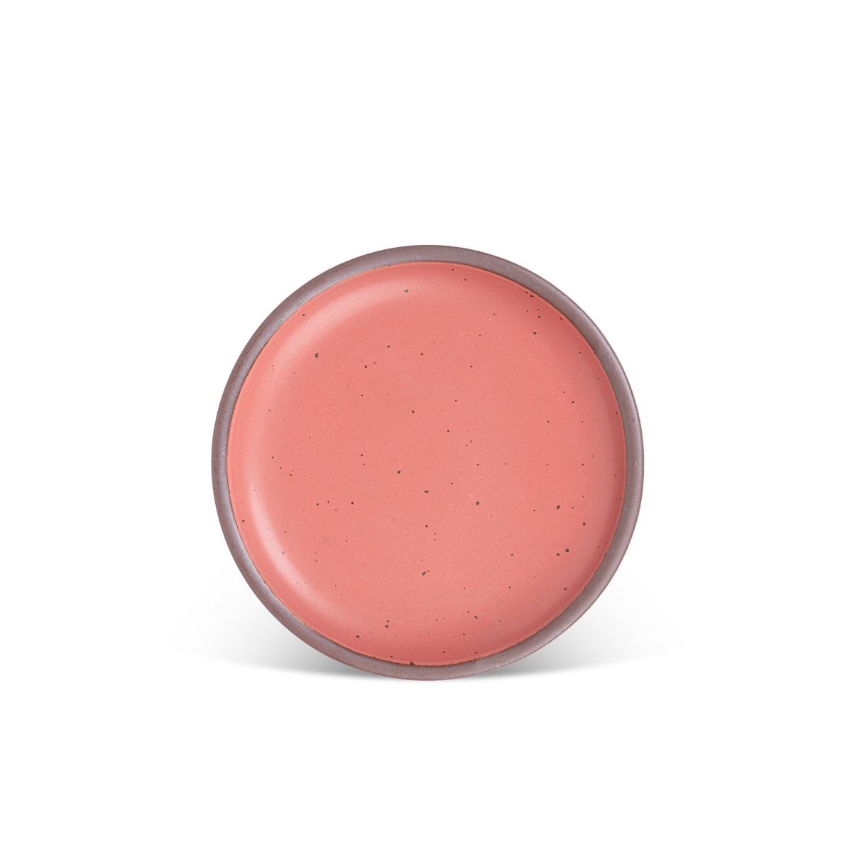 A medium sized ceramic plate in a watermelon pink color featuring iron speckles and an unglazed rim.