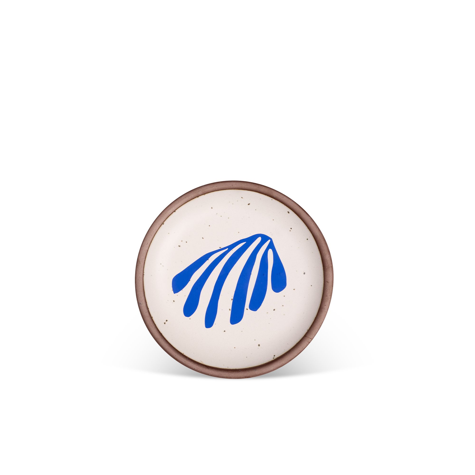 Abstract shape of a leaf in bright blue, centered on an off-white ceramic plate with an unglazed rim.