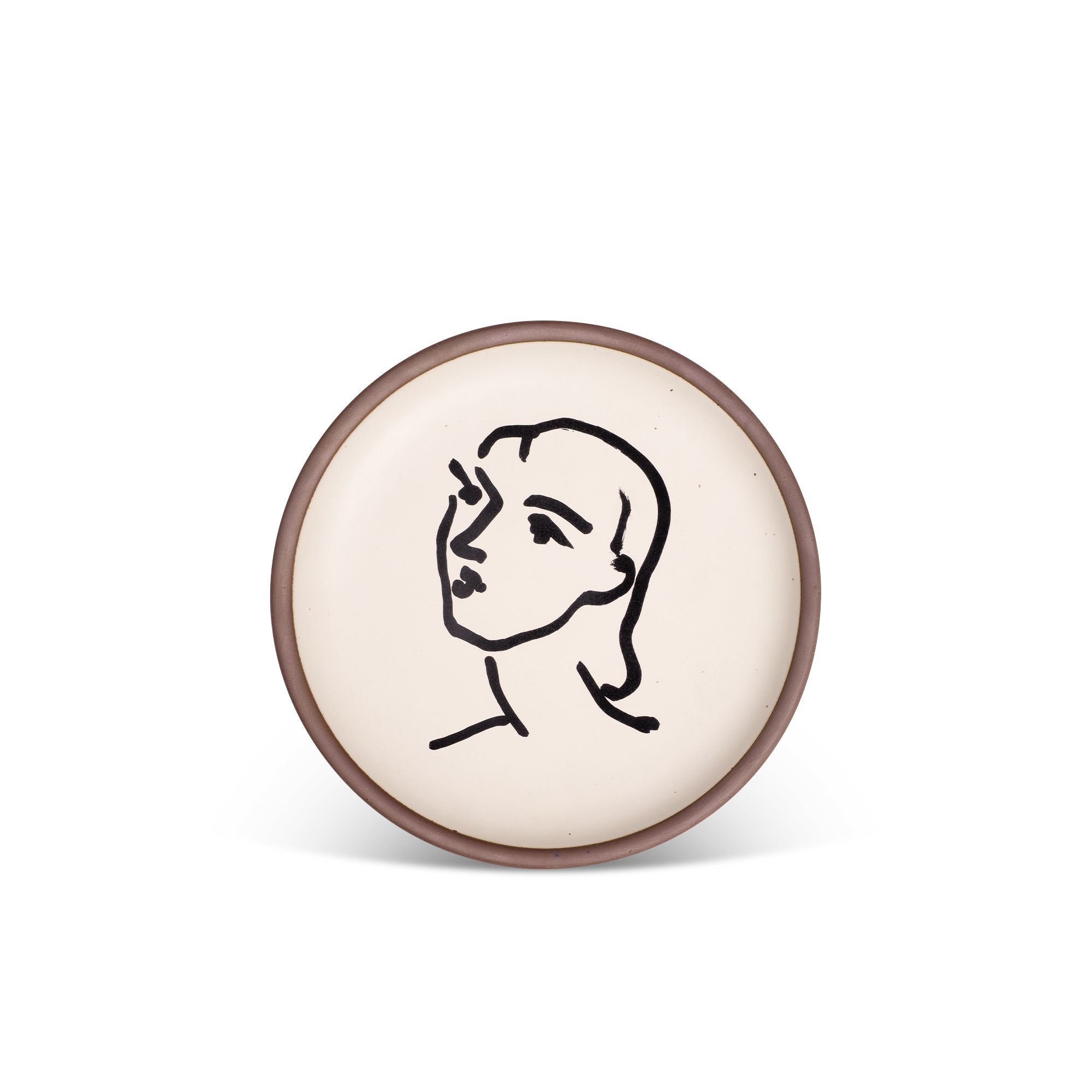 A minimalist black ink decal of a woman's face and neck in profile, facing left, in an abstract, expressive style centered on an off-white ceramic plate with an unglazed rim.