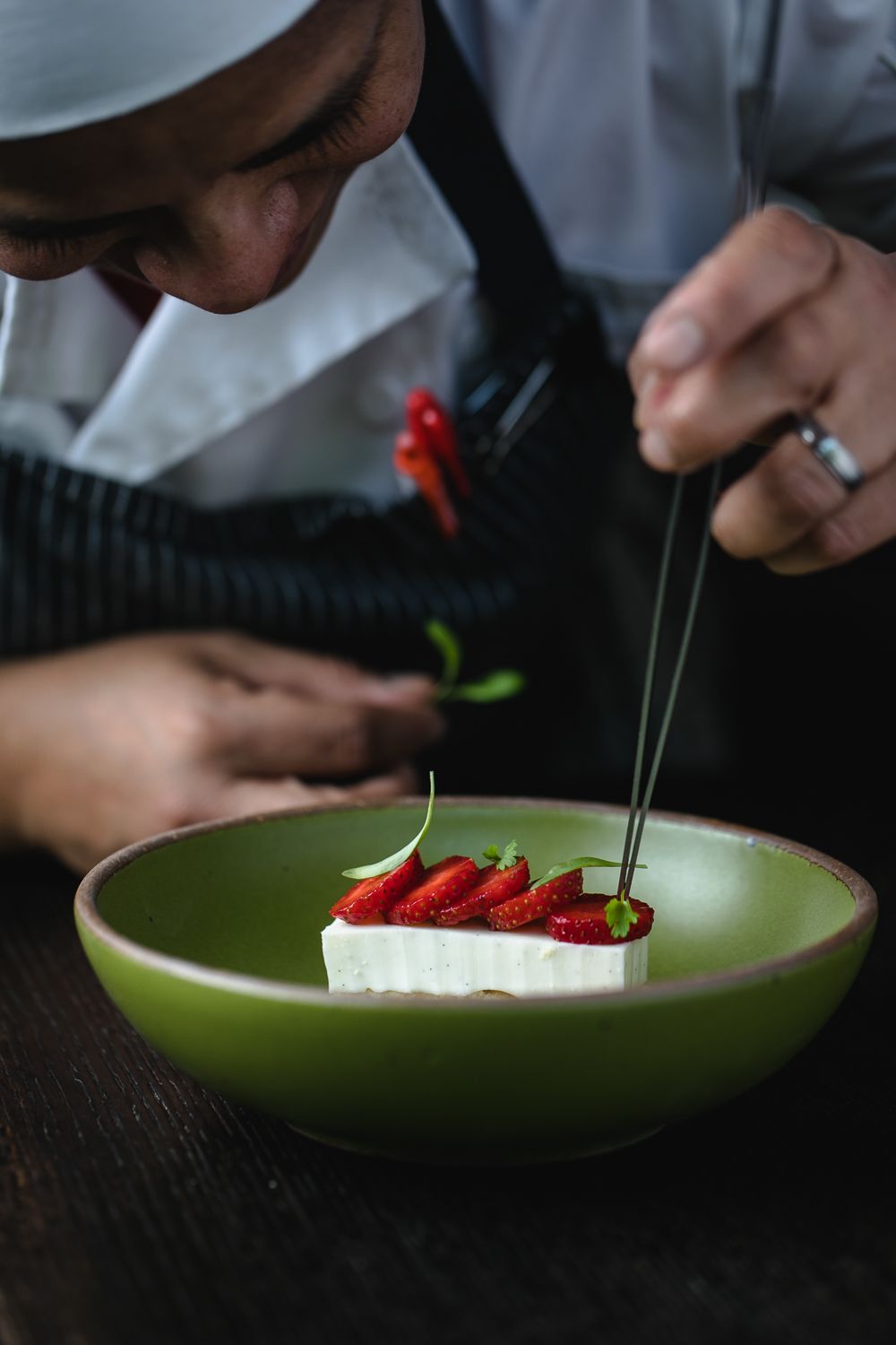 Carla, Bacchanalia's pastry chef, plates a straweberry dessert in an East Fork everyday bowl