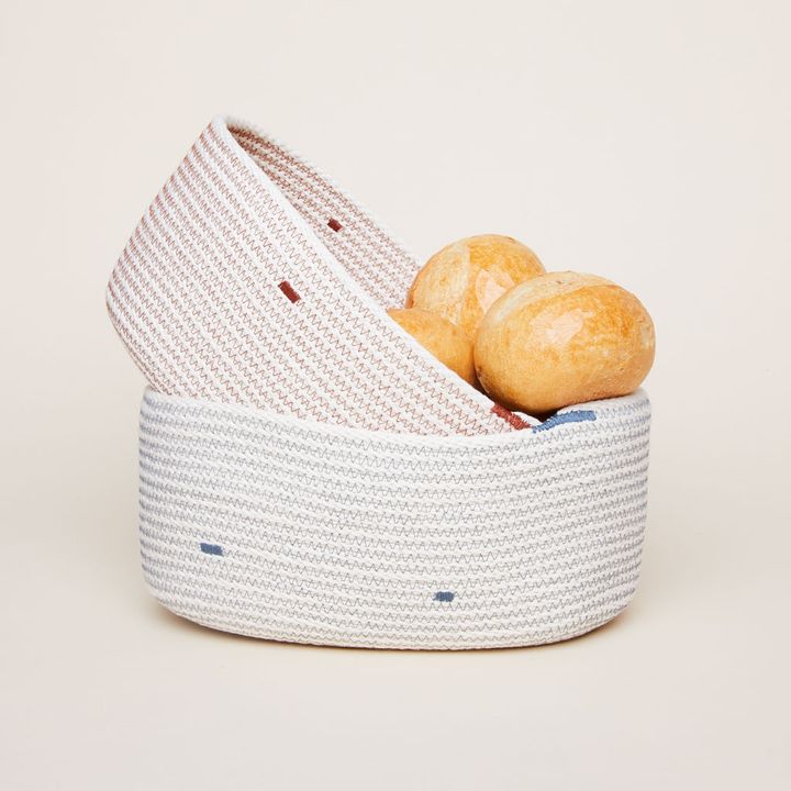 The Northern Market Bread Baskets woven from beige thread sewn with thread of various colors