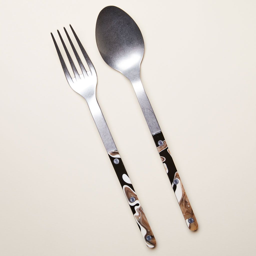 A set of two long-necked serving pieces: a fork and a spoon with black and brown handles