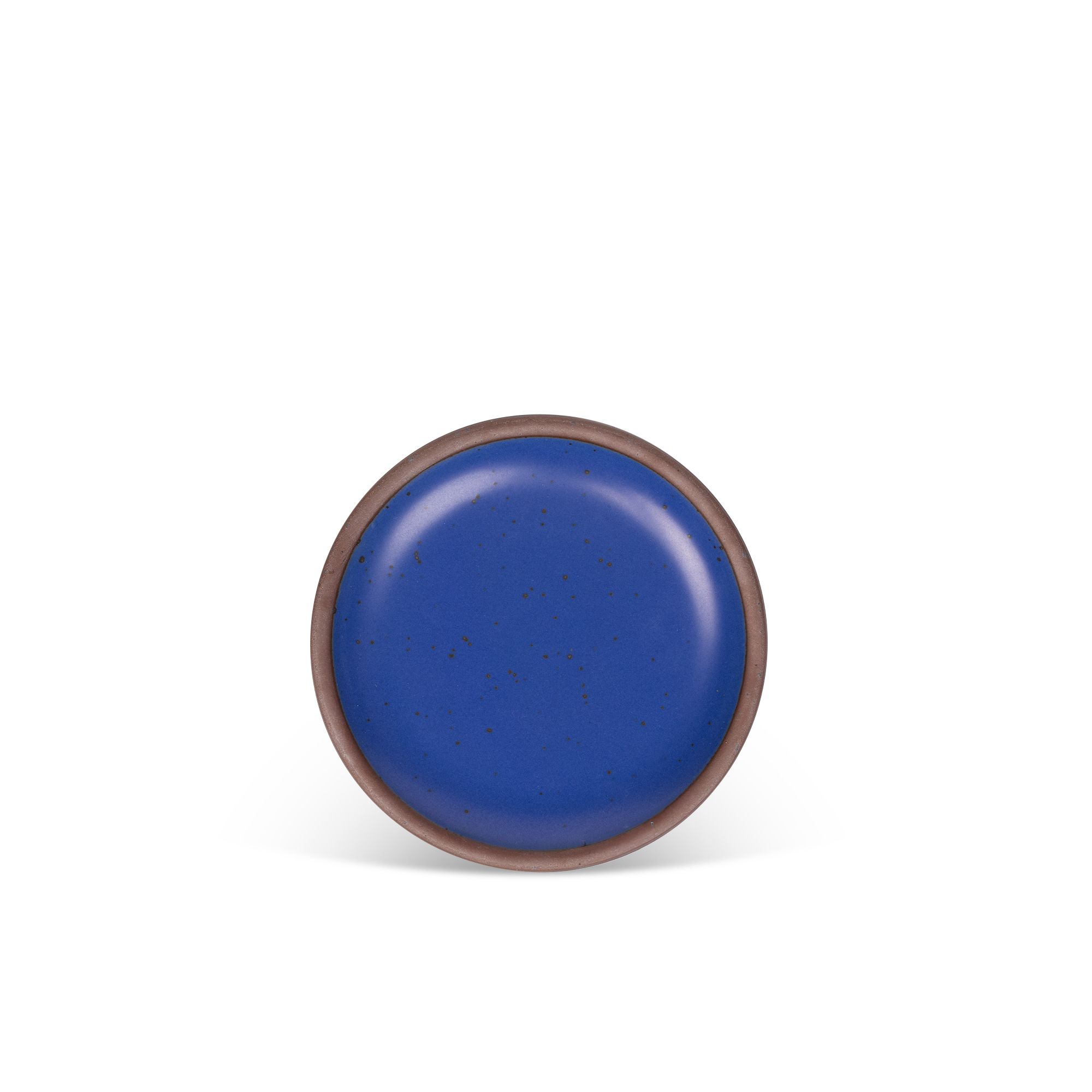 A dessert sized ceramic plate in a cobalt blue color featuring iron speckles and an unglazed rim.