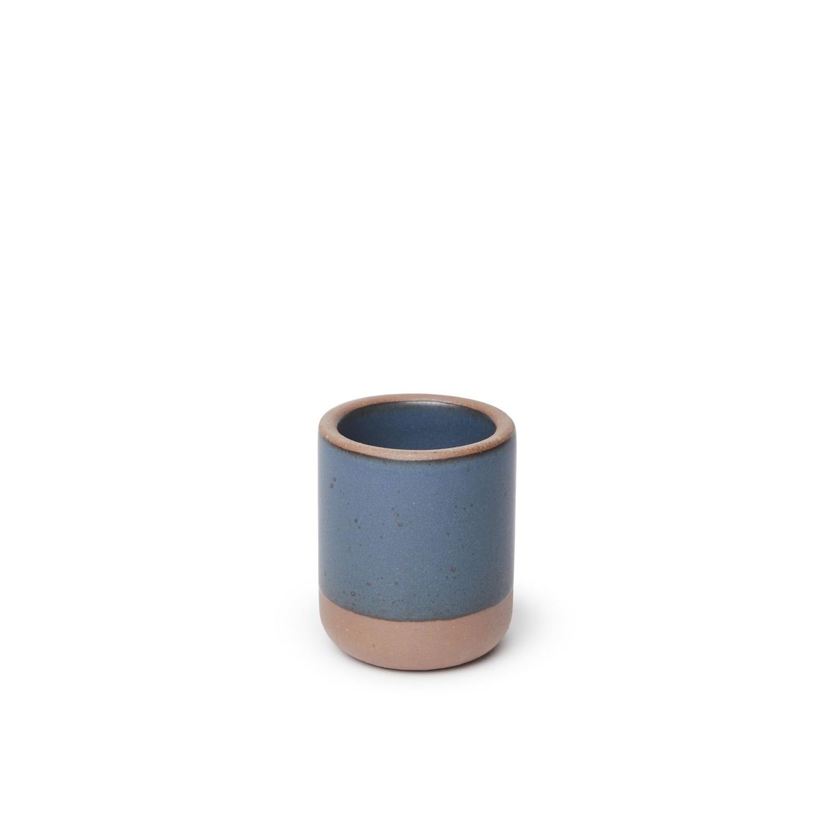 A small, short ceramic mug cup in a toned-down navy color featuring iron speckles and unglazed rim and bottom base.