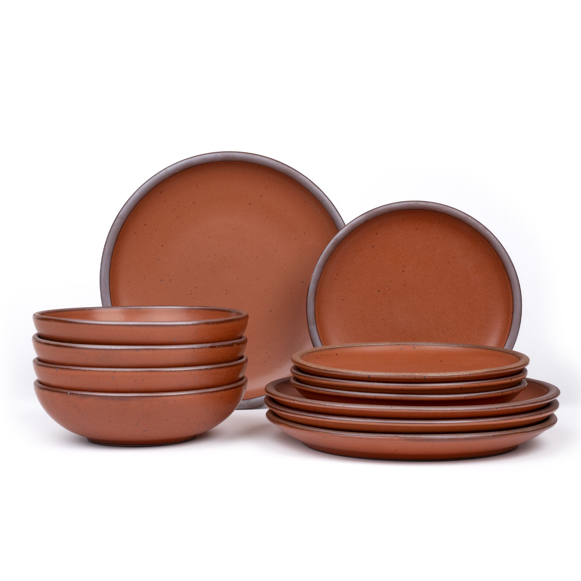 4 ceramic dinner plates, 4 side plates, and 4 shallow dinner bowls in a cool terracotta color with iron speckles and unglazed rims.