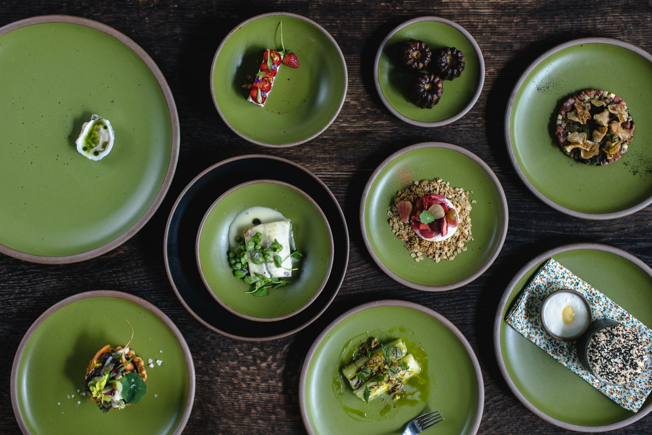 Bacchanalia menu plated on Fiddlehead dishes made by East Fork