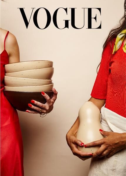 Women holding stacks of East Fork Pottery Bowls and Vases