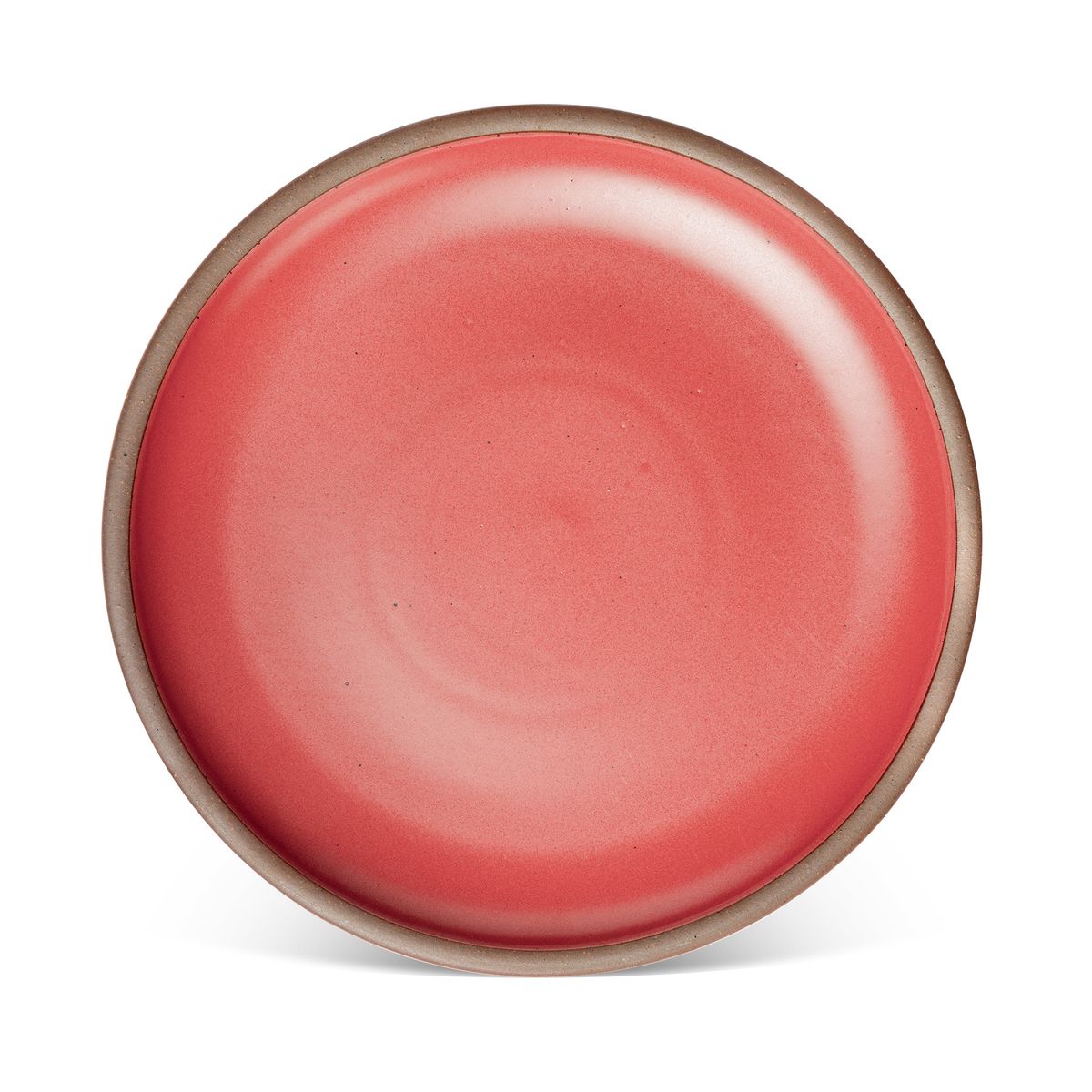 A large ceramic platter in a bold red color featuring iron speckles and an unglazed rim