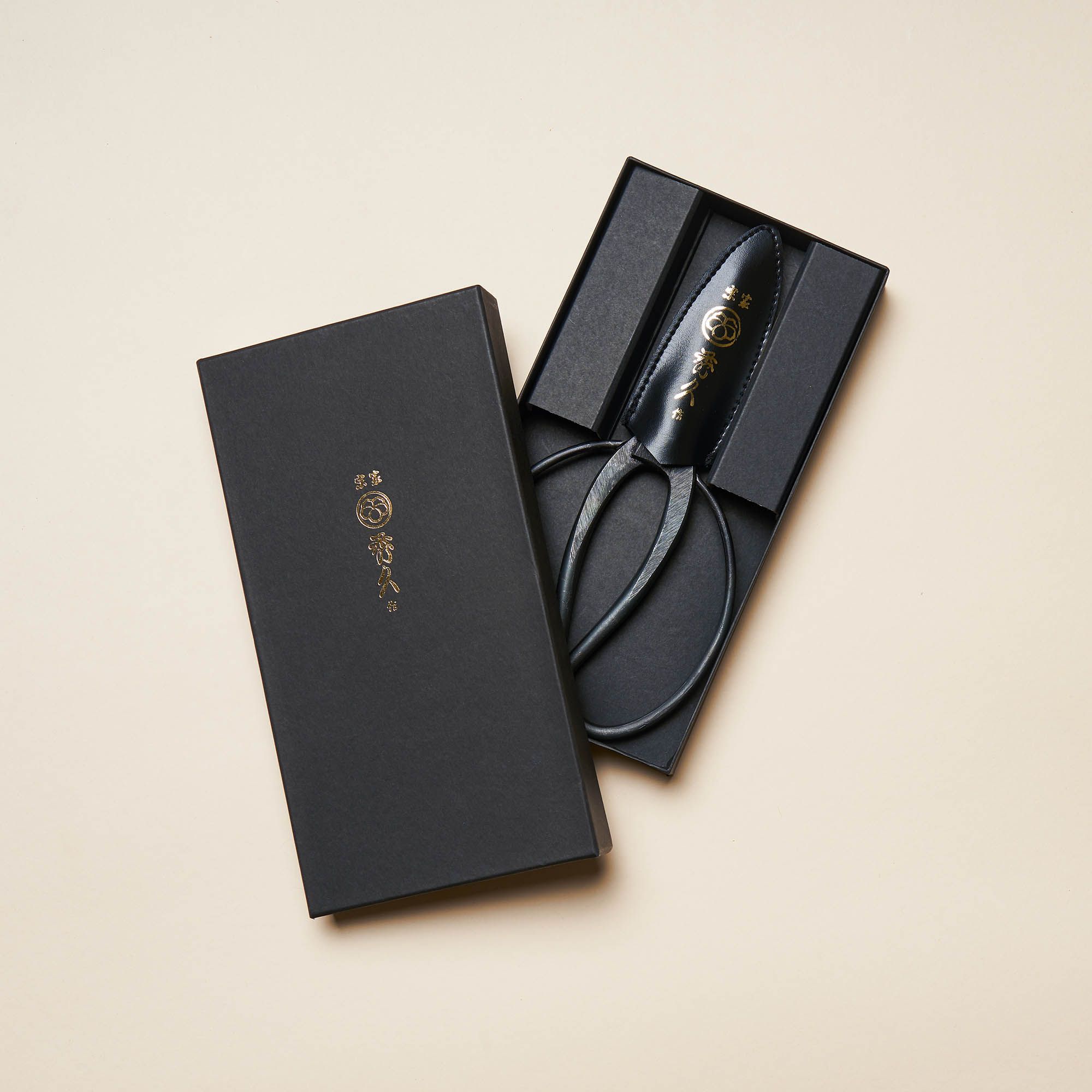 Japanese Gardening Shears sit in an open black box