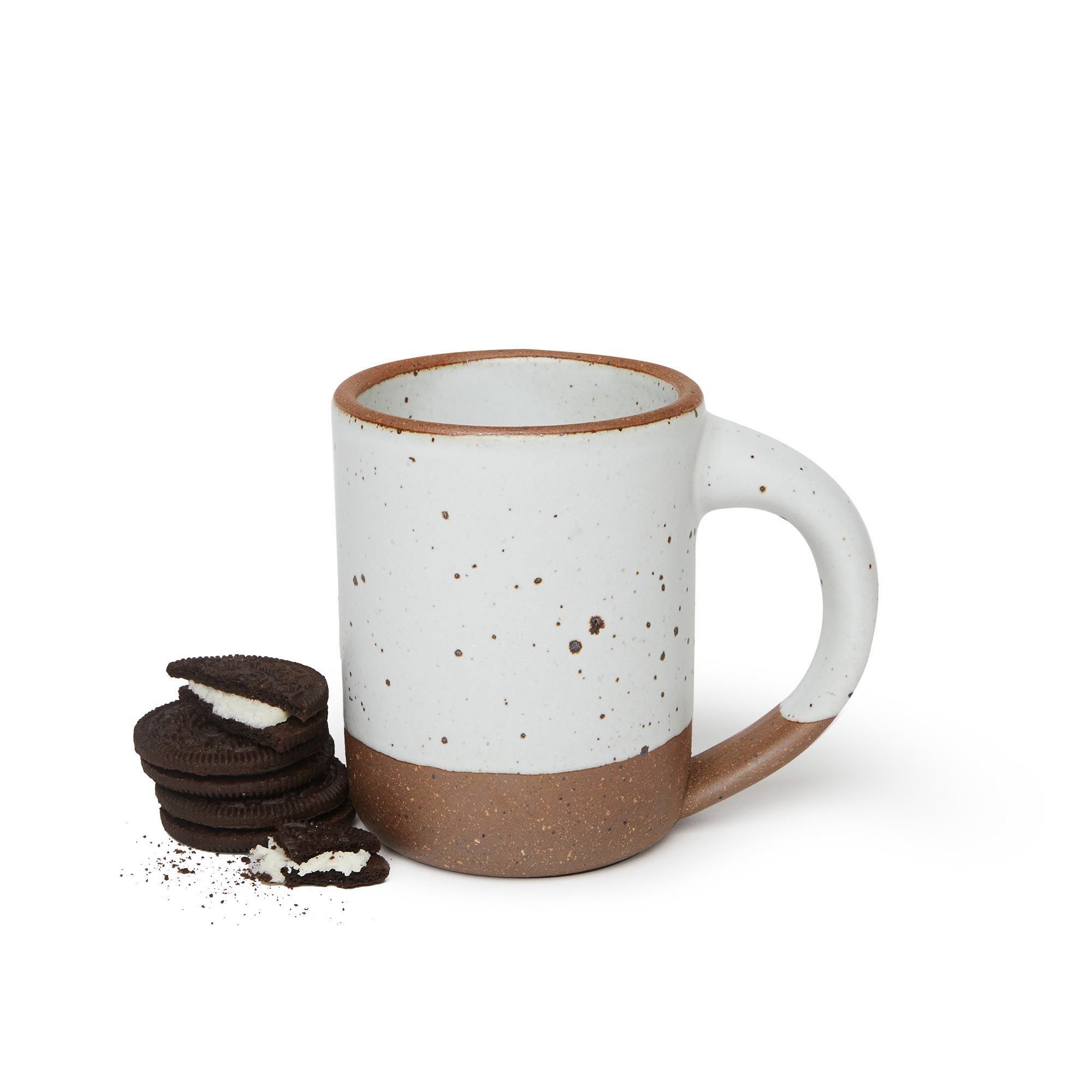 Truly, a perfectly sized and shaped mug. With a stack of cookies next to it.
