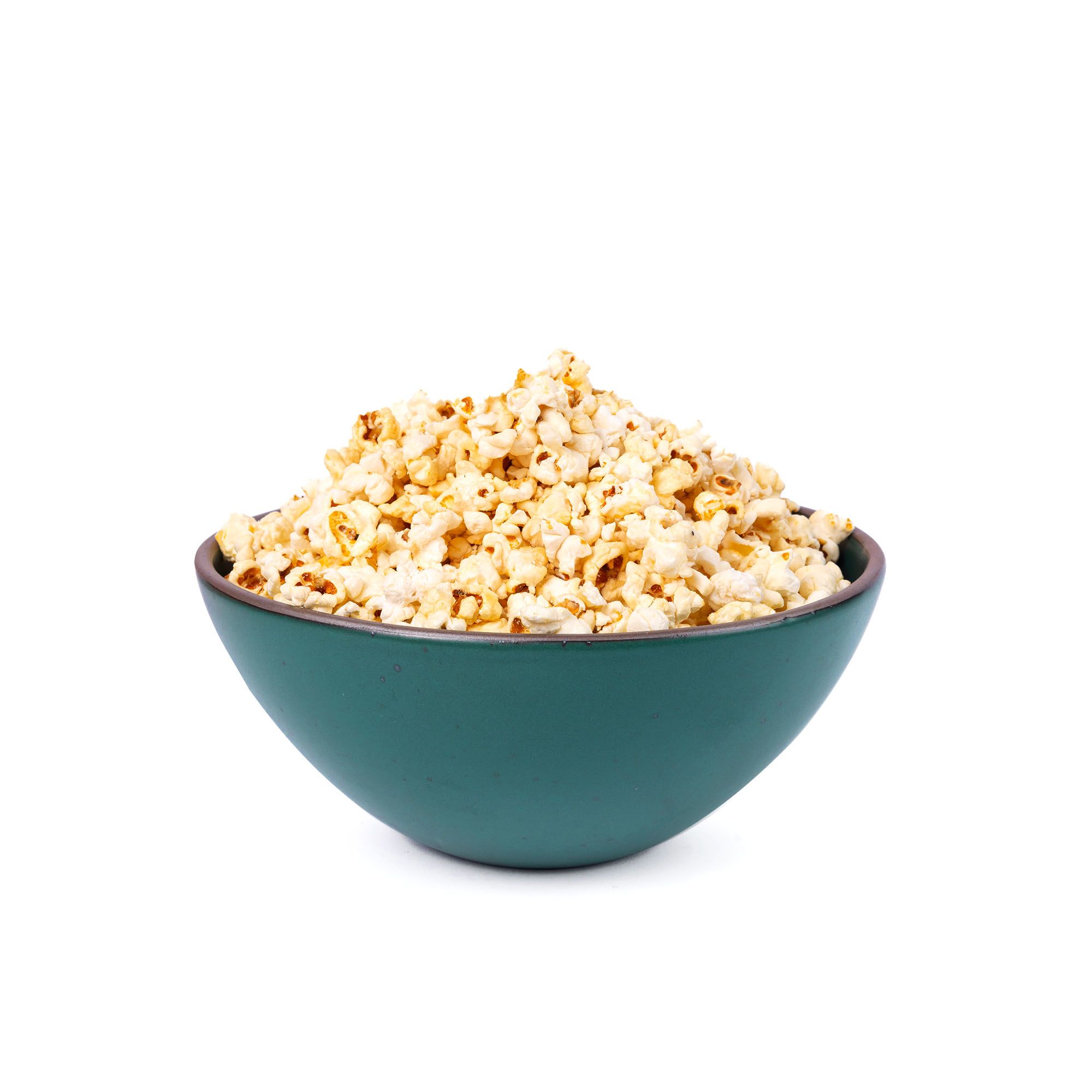 Popcorn in a large rounded ceramic bowl in a deep dark teal color featuring iron speckles and an unglazed rim