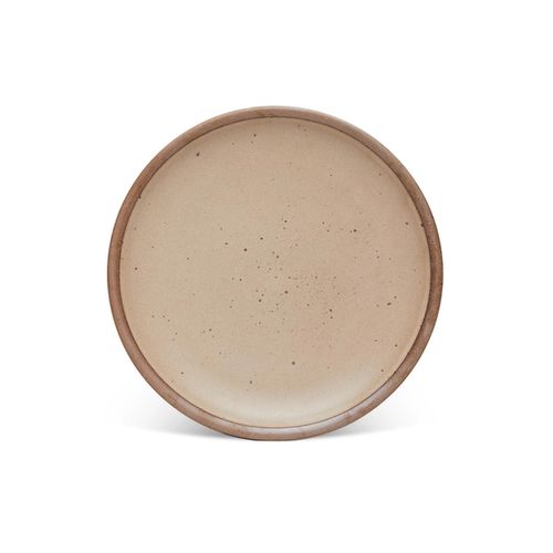 A dinner sized ceramic plate in a warm pale brown color featuring iron speckles and an unglazed rim.