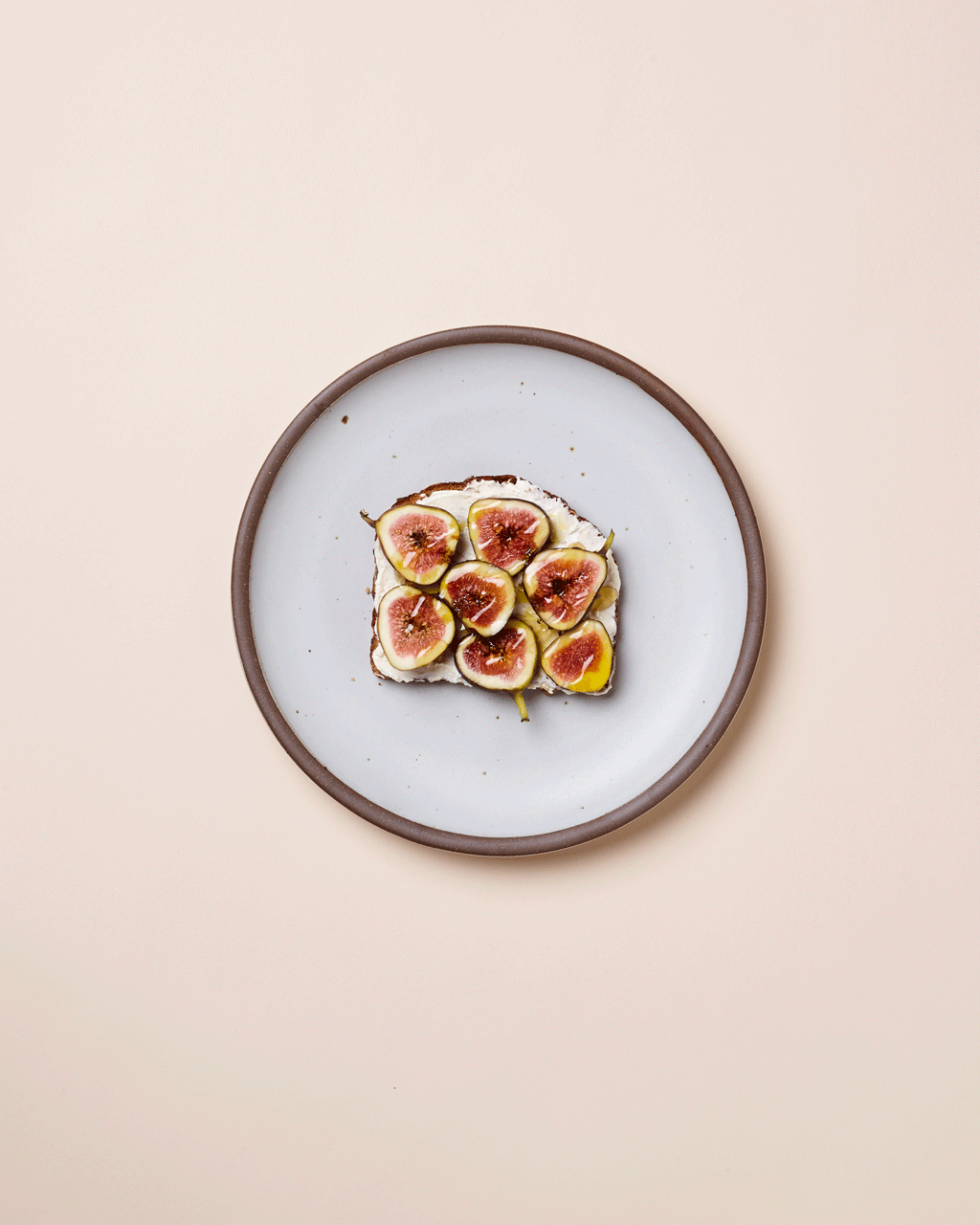 Stop motion gif of Dinner Plate plated with Figs on Toast that gets a bite taken out of it frame-by-frame
