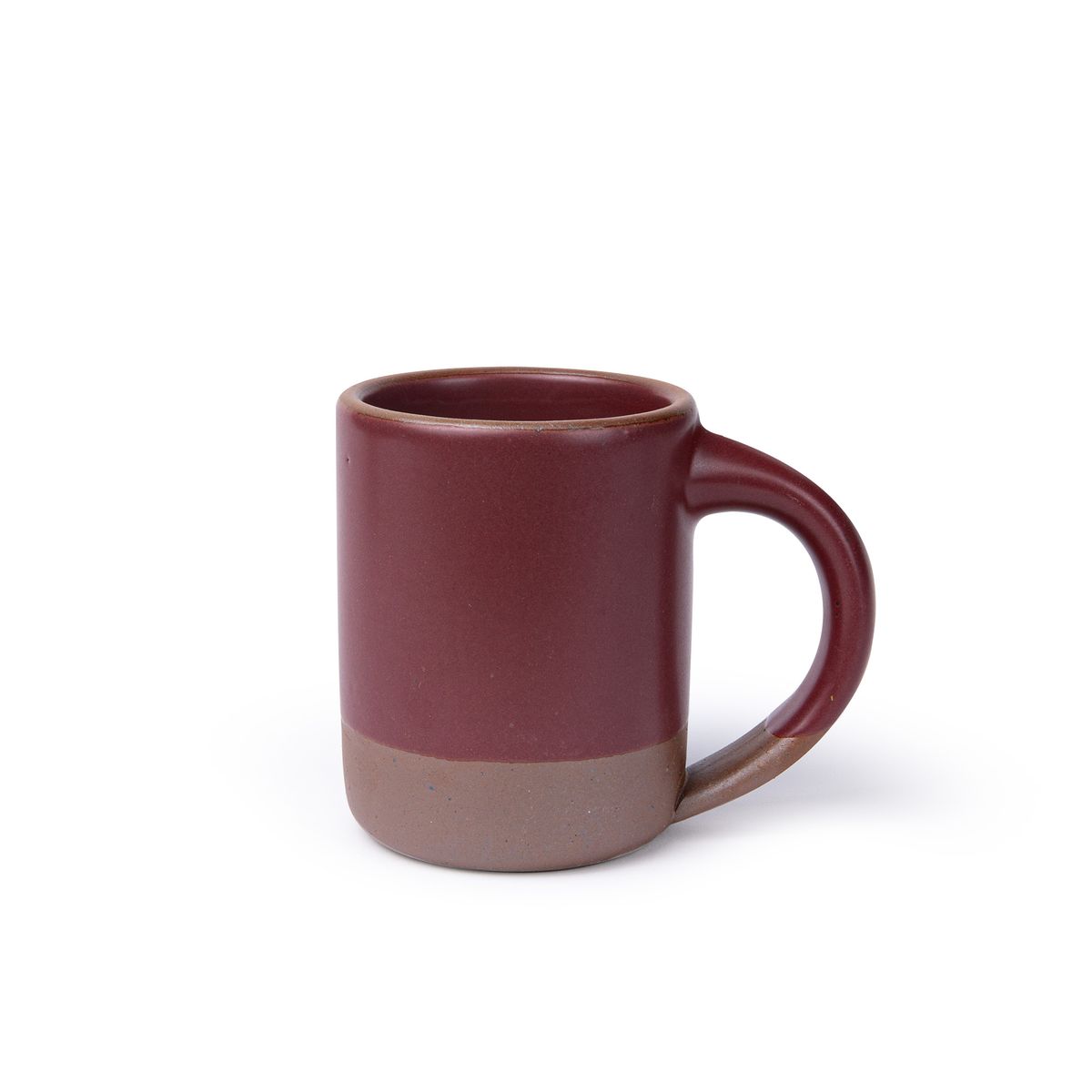 A medium sized ceramic mug with handle in a plum color featuring iron speckles and unglazed rim.