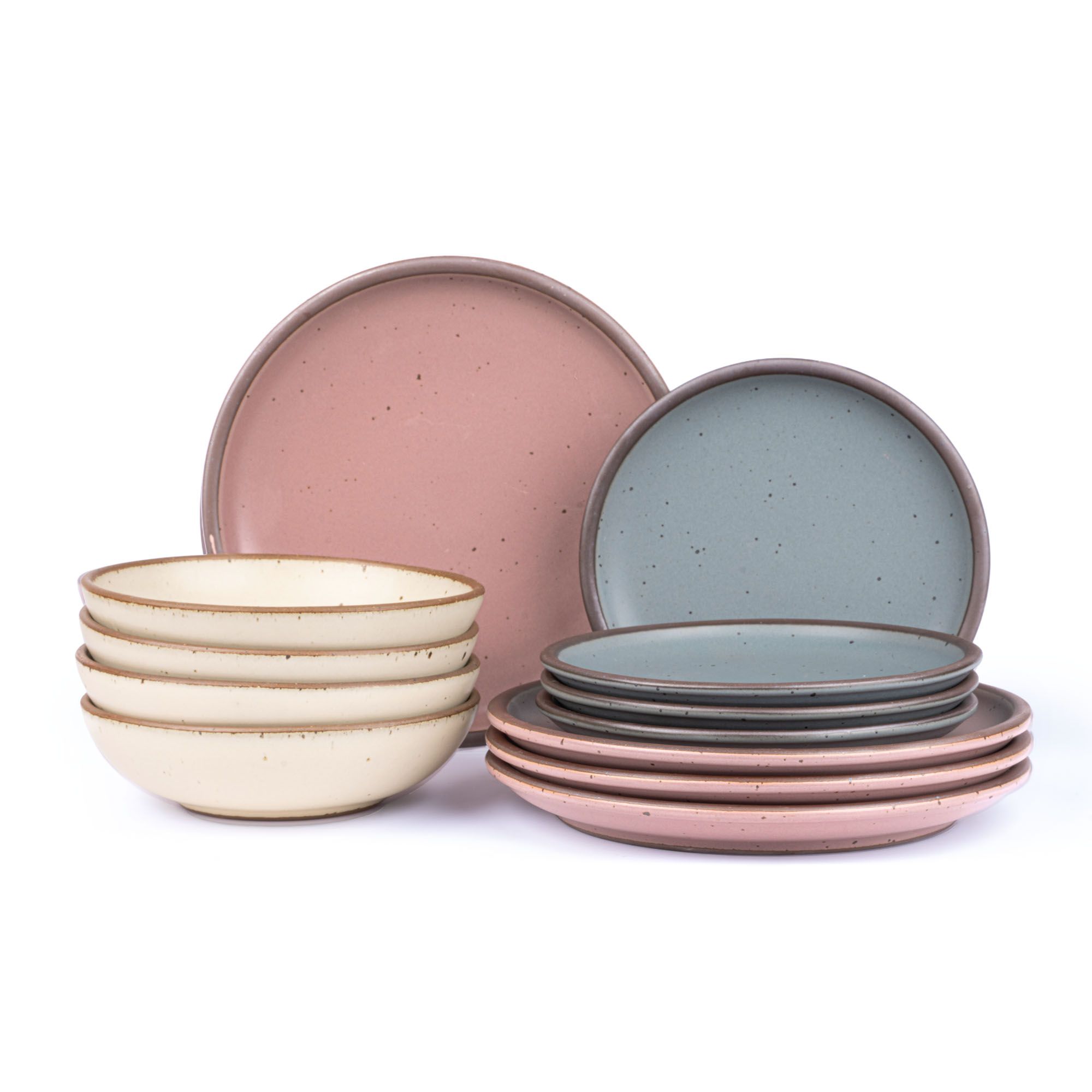 4 ceramic dinner plates in dusty mauve pink, 4 side plates in blue-grey, and 4 shallow dinner bowls in warm off-white with iron speckles and unglazed rims.