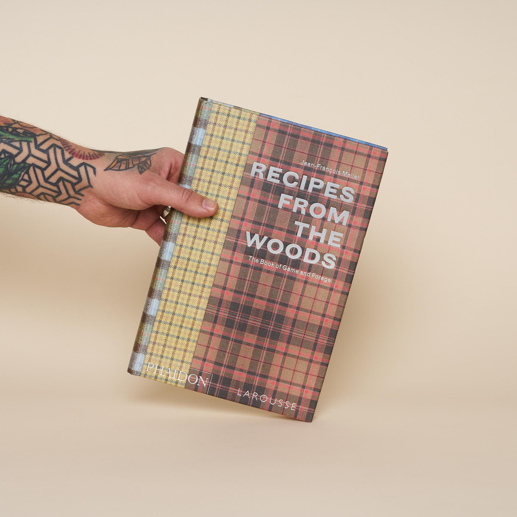 A cookbook with a vintage feel. The cover has three different types of plaid, the types you may have found on your grandfather's 70's dinner jacket.