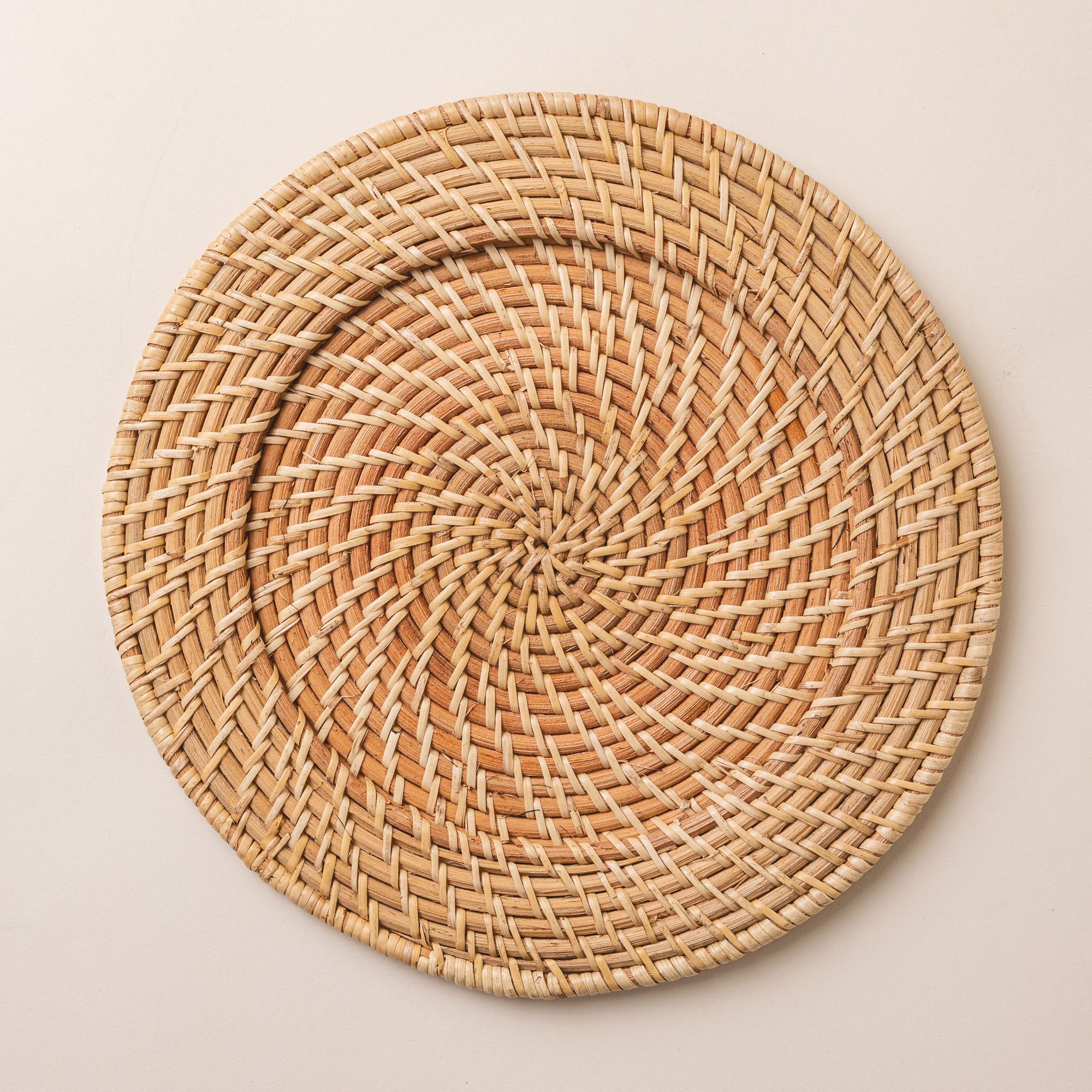 One natural hand woven dinner plate charger.