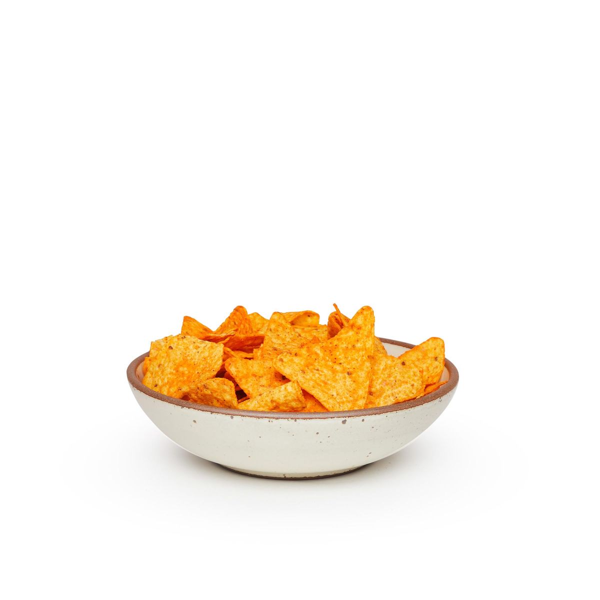 A dinner-sized shallow ceramic bowl in a warm, tan-toned, off-white color featuring iron speckles and an unglazed rim, filled with chips