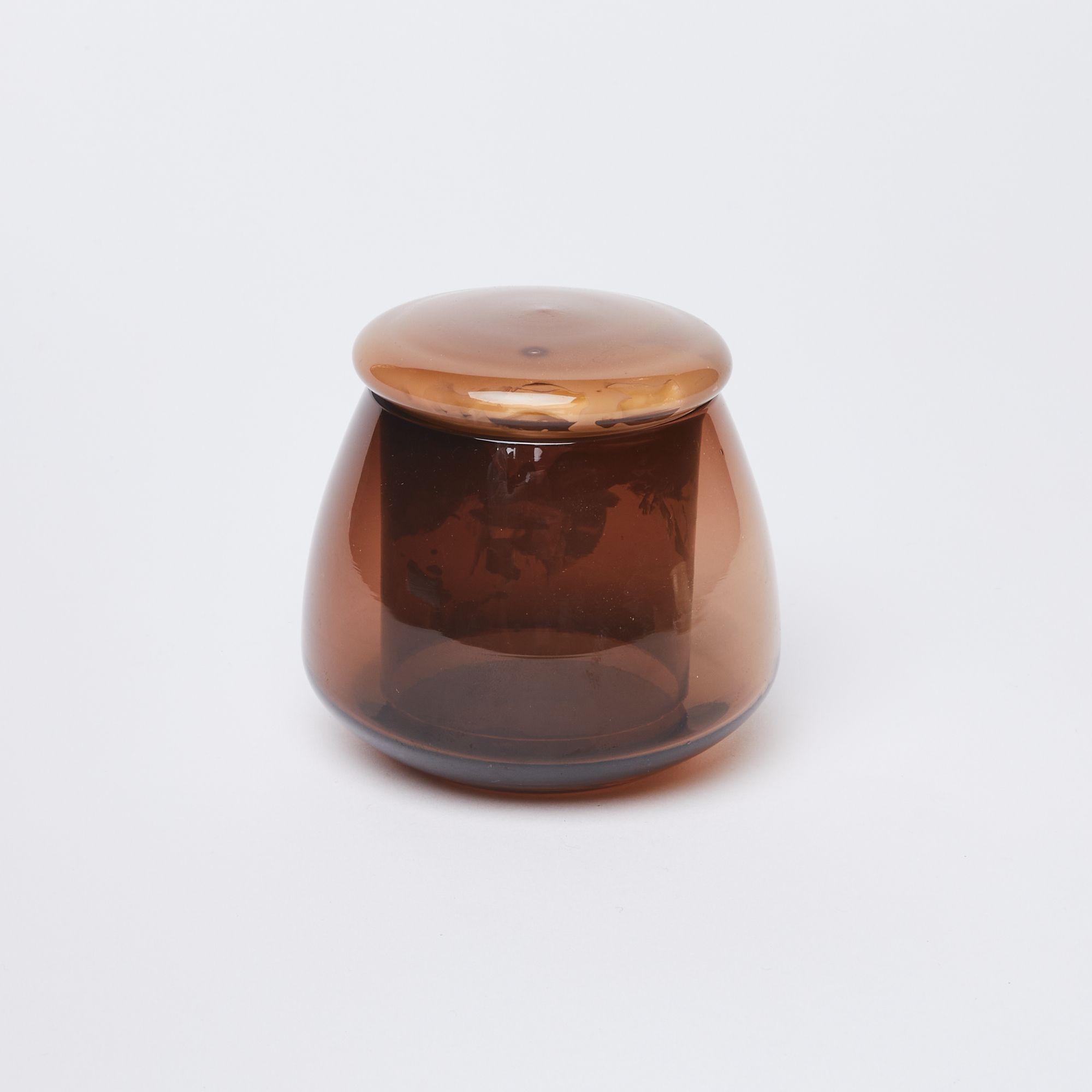 Brown glass butter keeper filled with butter