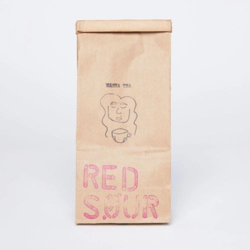 Brown paper coffee bag with red 'Red Sour' stamp and logo stamp