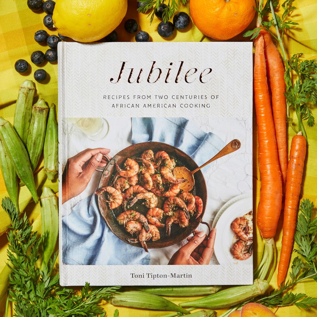 A copy of Jubilee: Recipes from Two Centuries of African American Cooking surrounded by okra, carrots and fruit
