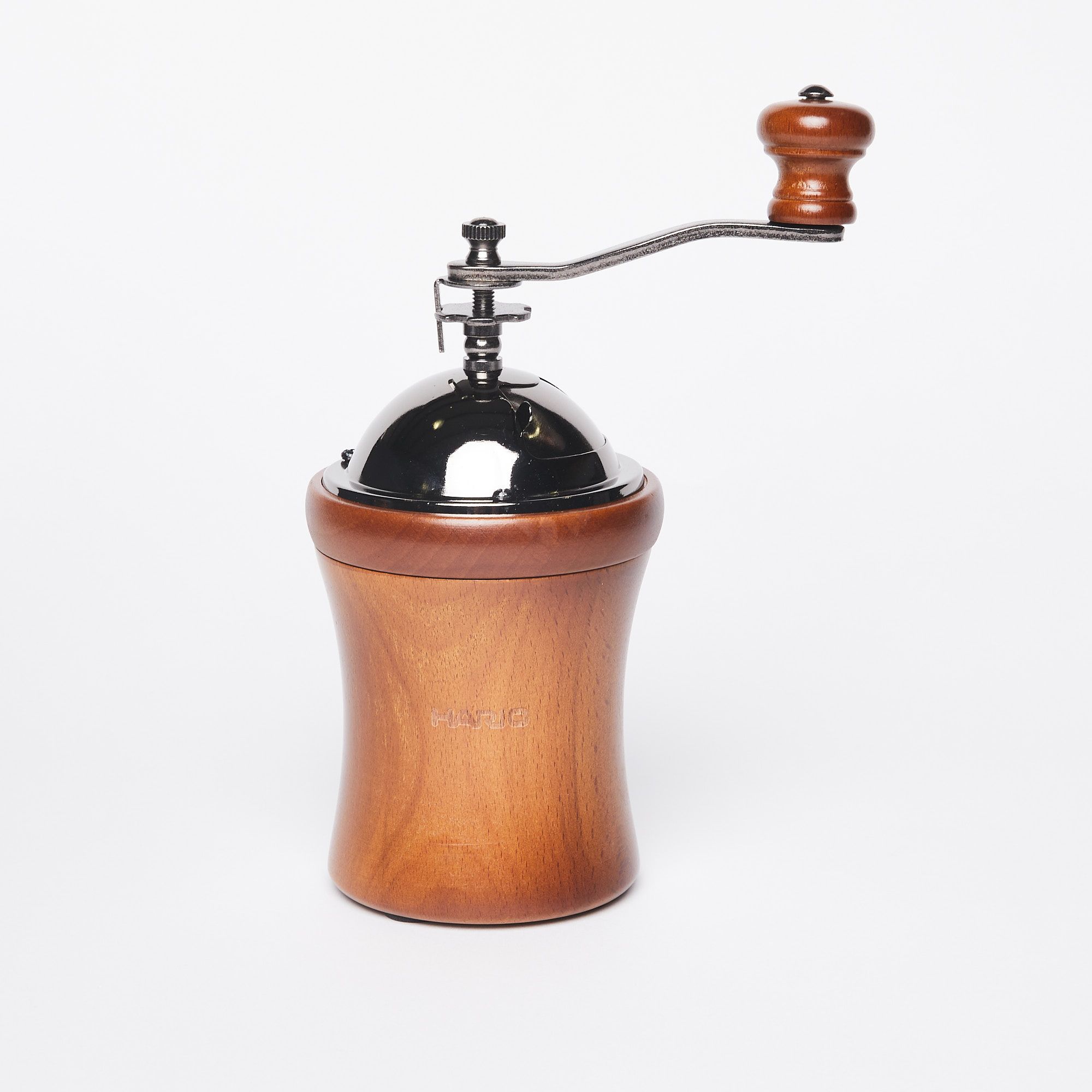 Wide hourglass shaped wood base with metal domed top and handle with a wood knob