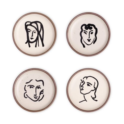Four ceramic medium-sized plates in a warm off-white color with unglazed rim, featuring black aquatint portrait artworks by Henri Matisse.