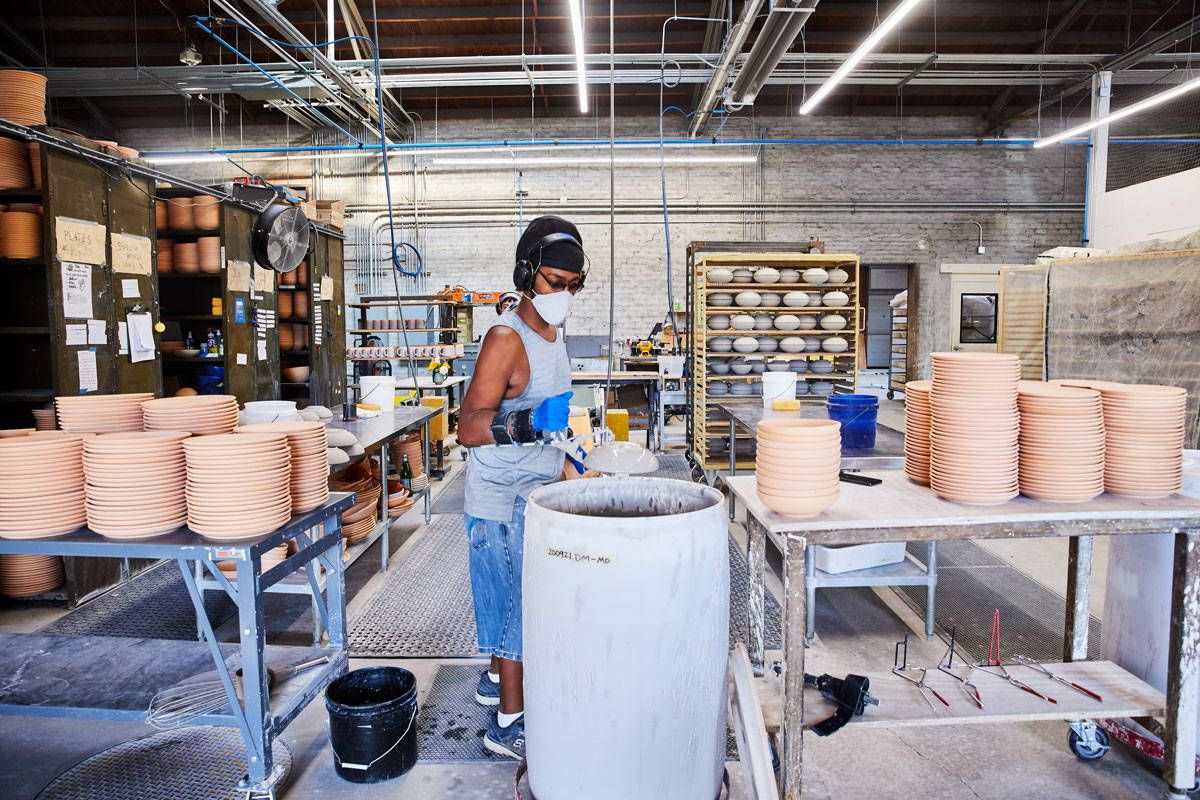 East Fork Pottery Employee Glazing Pots At Asheville Factory