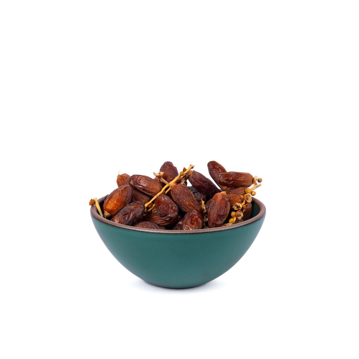 Food inside a medium rounded ceramic bowl in a deep dark teal color featuring iron speckles and an unglazed rim