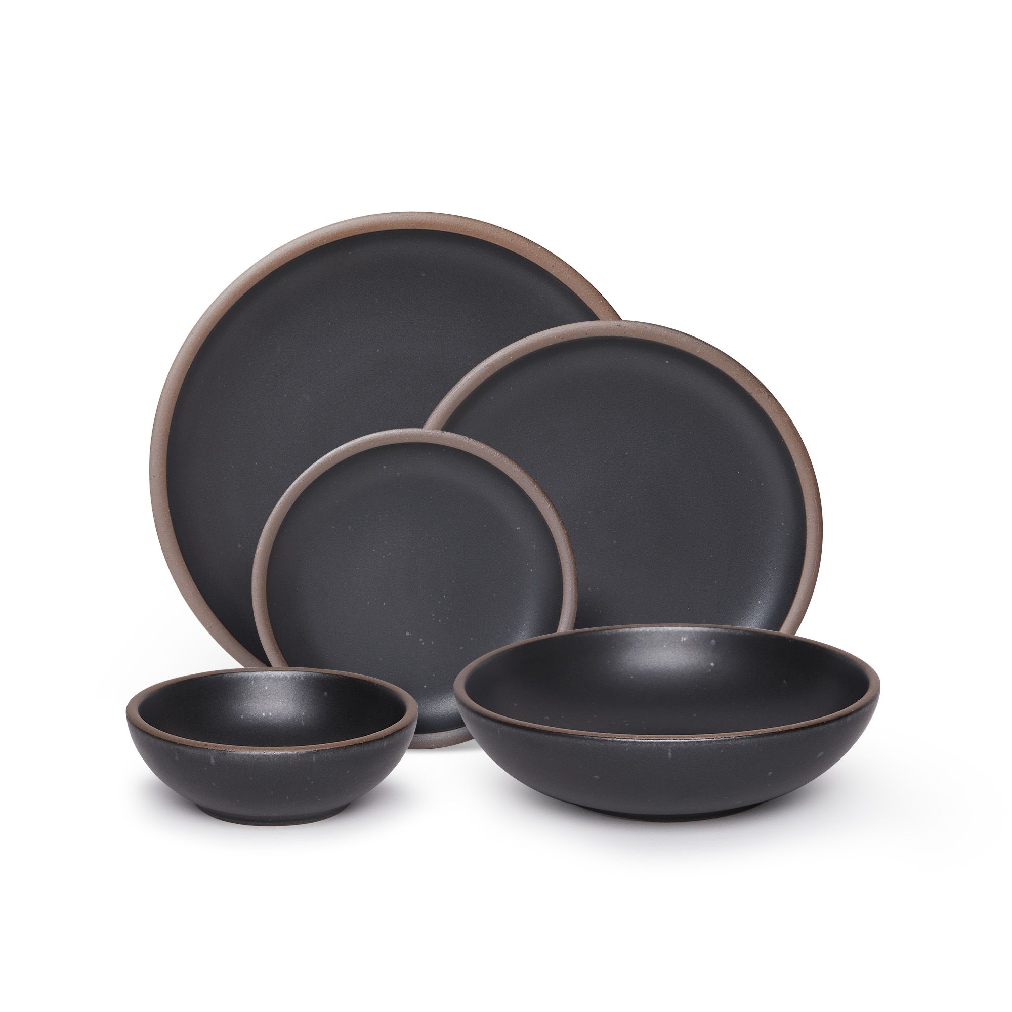 A breakfast bowl, everyday bowl, cake plate, side plate and dinner plate paired together in a graphite black featuring iron speckles