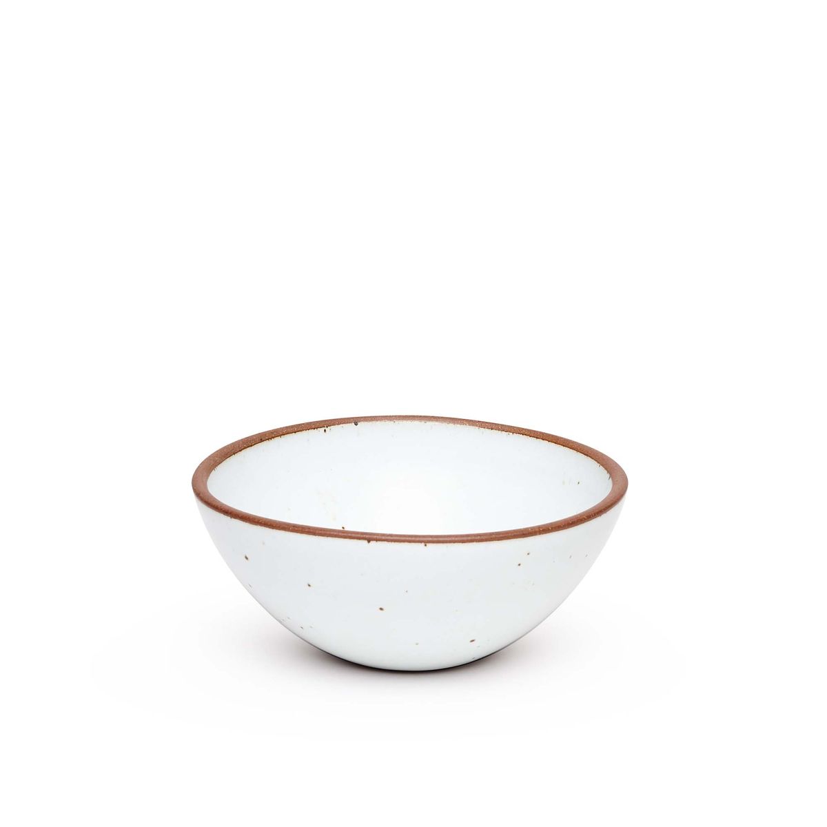 A medium rounded ceramic bowl in a cool white color featuring iron speckles and an unglazed rim