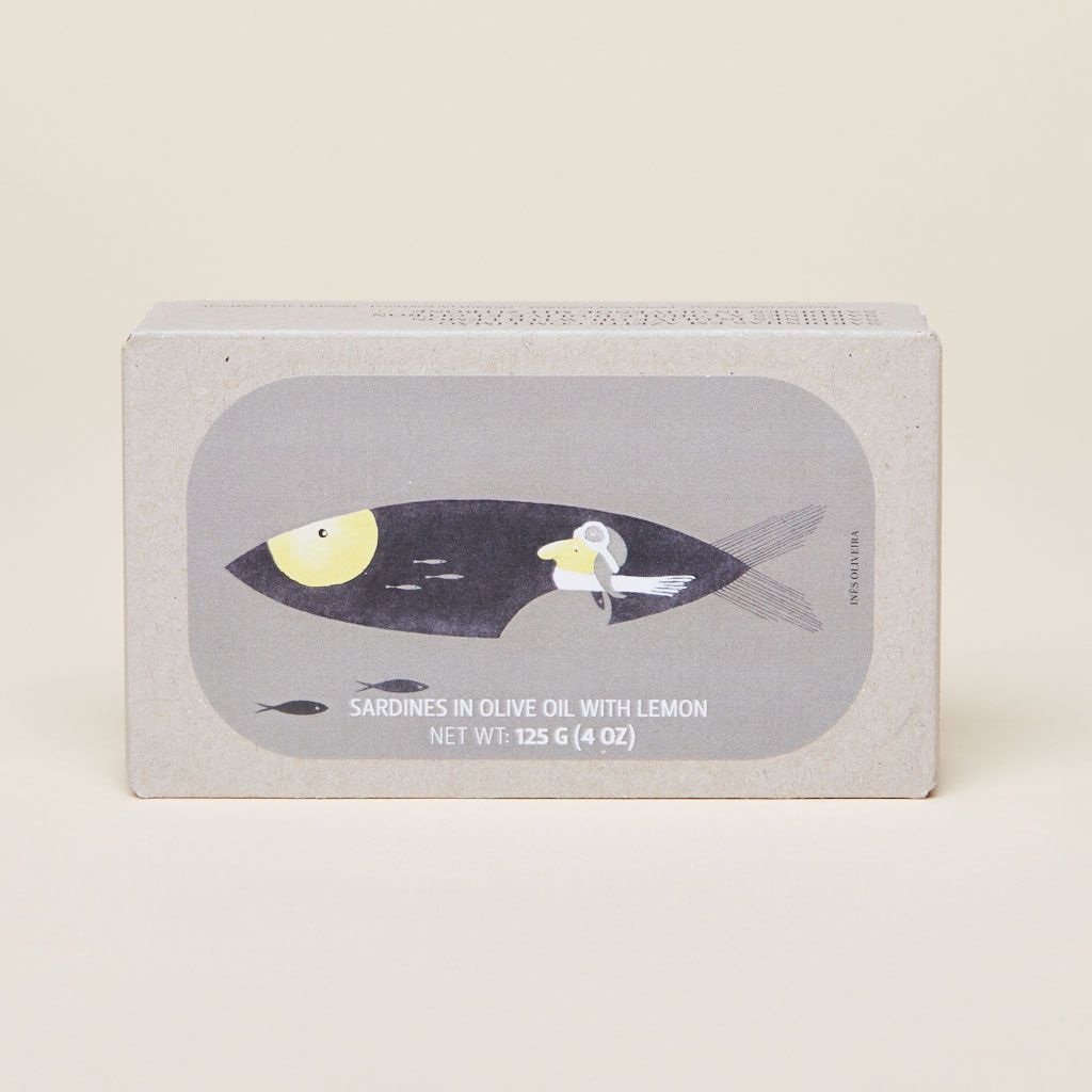 Rectangular light brown box with gray label that has a black, gray, white and yellow illustration of sardines