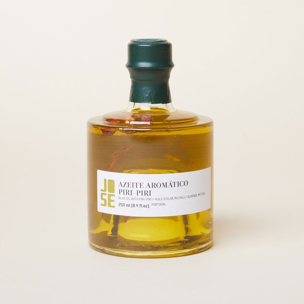 Green cap on a full bottle of olive oil