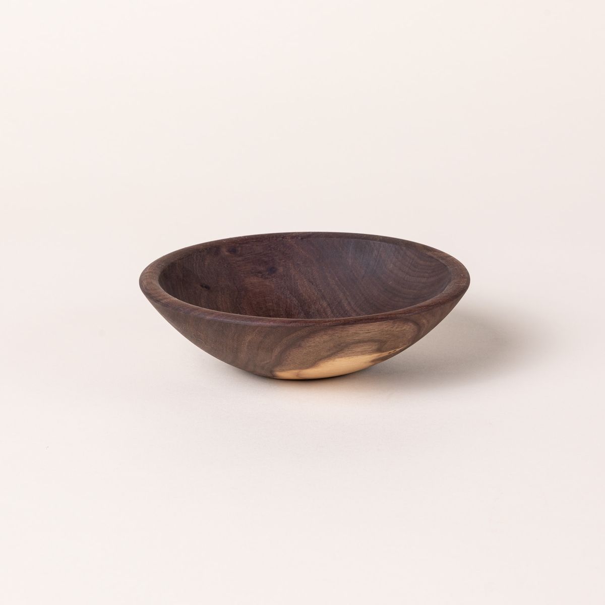 A small walnut wood bowl