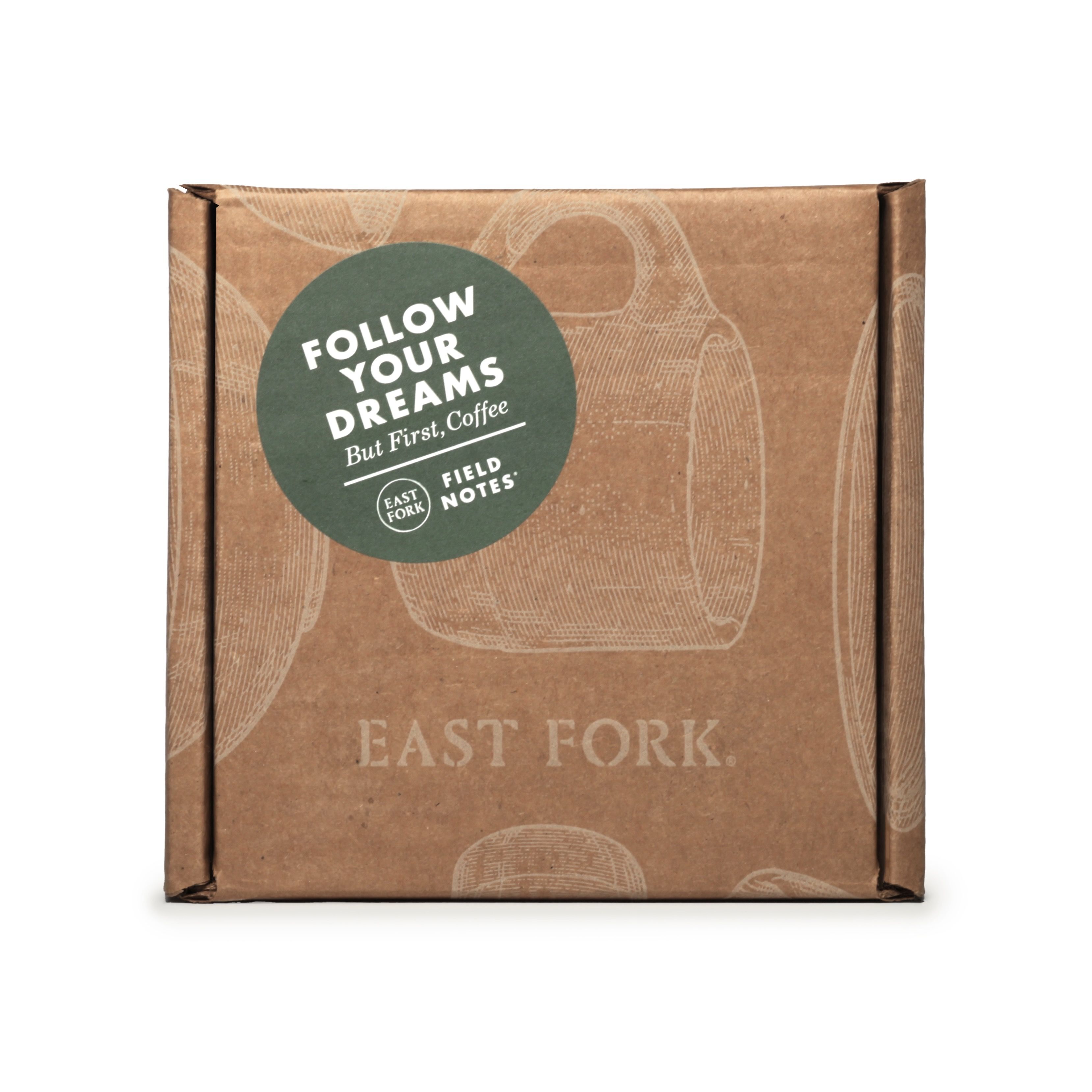 A square cardboard box with an illustration of a Mug and branding that says 'East Fork' and a sticker that says 'Follow your dreams' with East Fork x Field Notes branding.