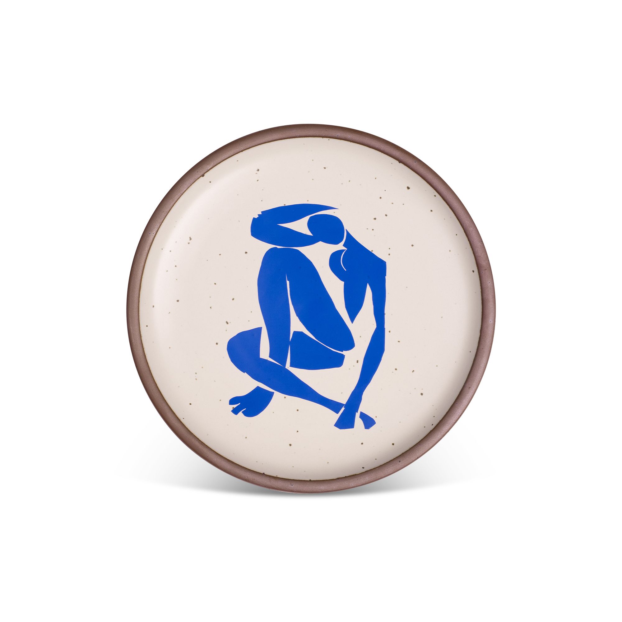 A bright blue, abstract, silhouetted female figure in a curled, seated position, with sharp cut-out edges, centered on an off-white ceramic plate with an unglazed rim.