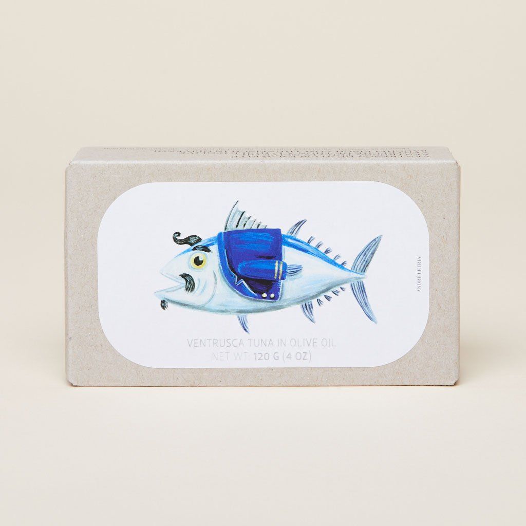 Tan and white rectangular box with a blue illustration of a tuna in a blue jacket