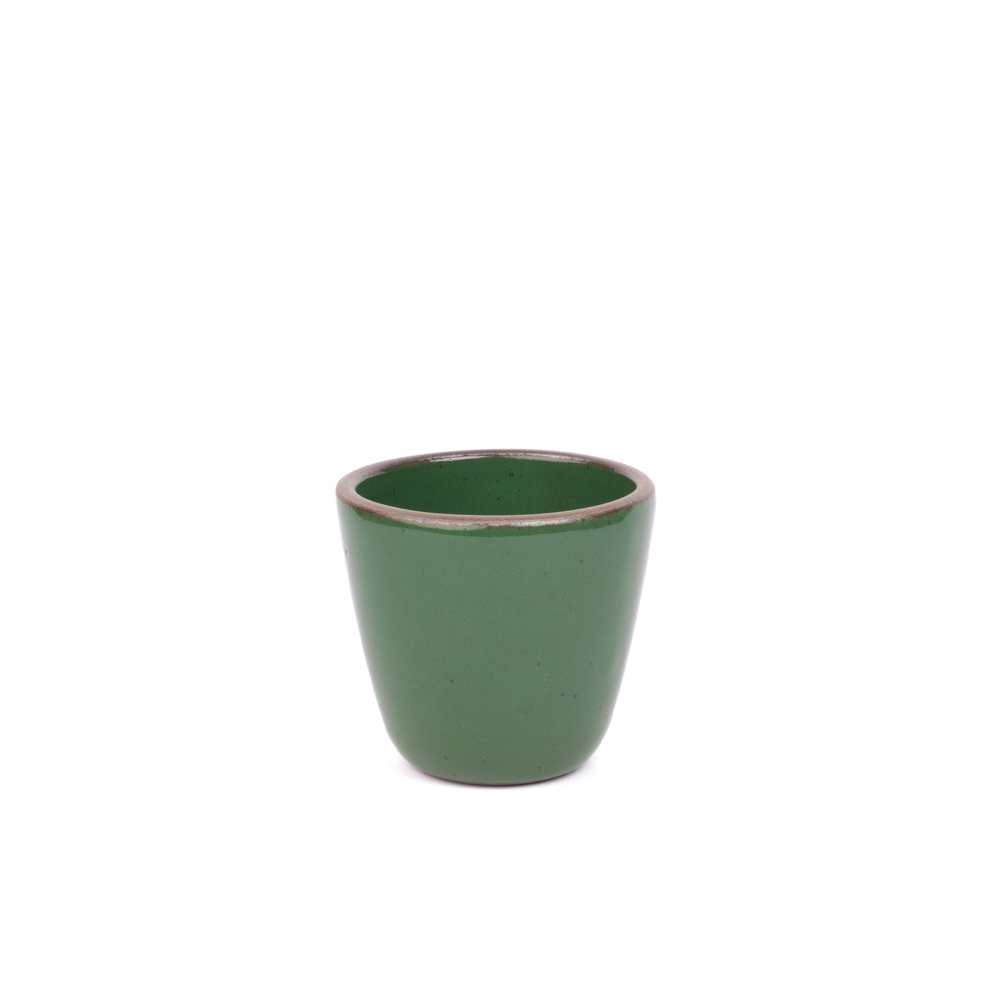 A short cup that tapers out to get wider at the top in a glossy emerald green color featuring iron speckles