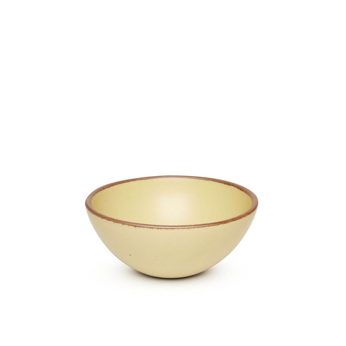A medium rounded ceramic bowl in a light butter yellow color featuring iron speckles and an unglazed rim