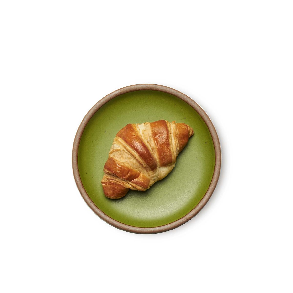 Side Plate in Fiddlehead, a mossy, olive green. Pictured with a crescent roll.