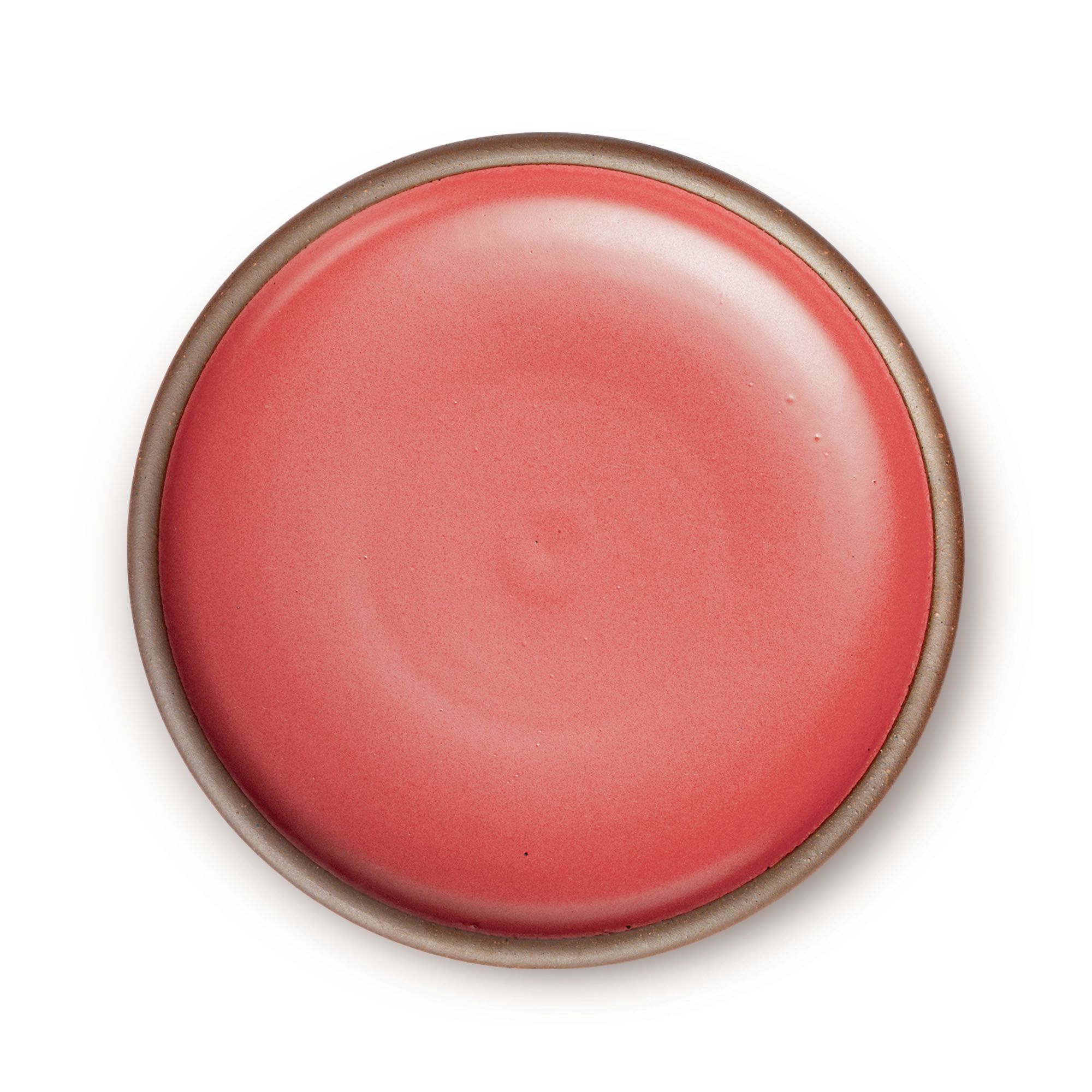 A large ceramic platter in a bold red color featuring an unglazed rim.