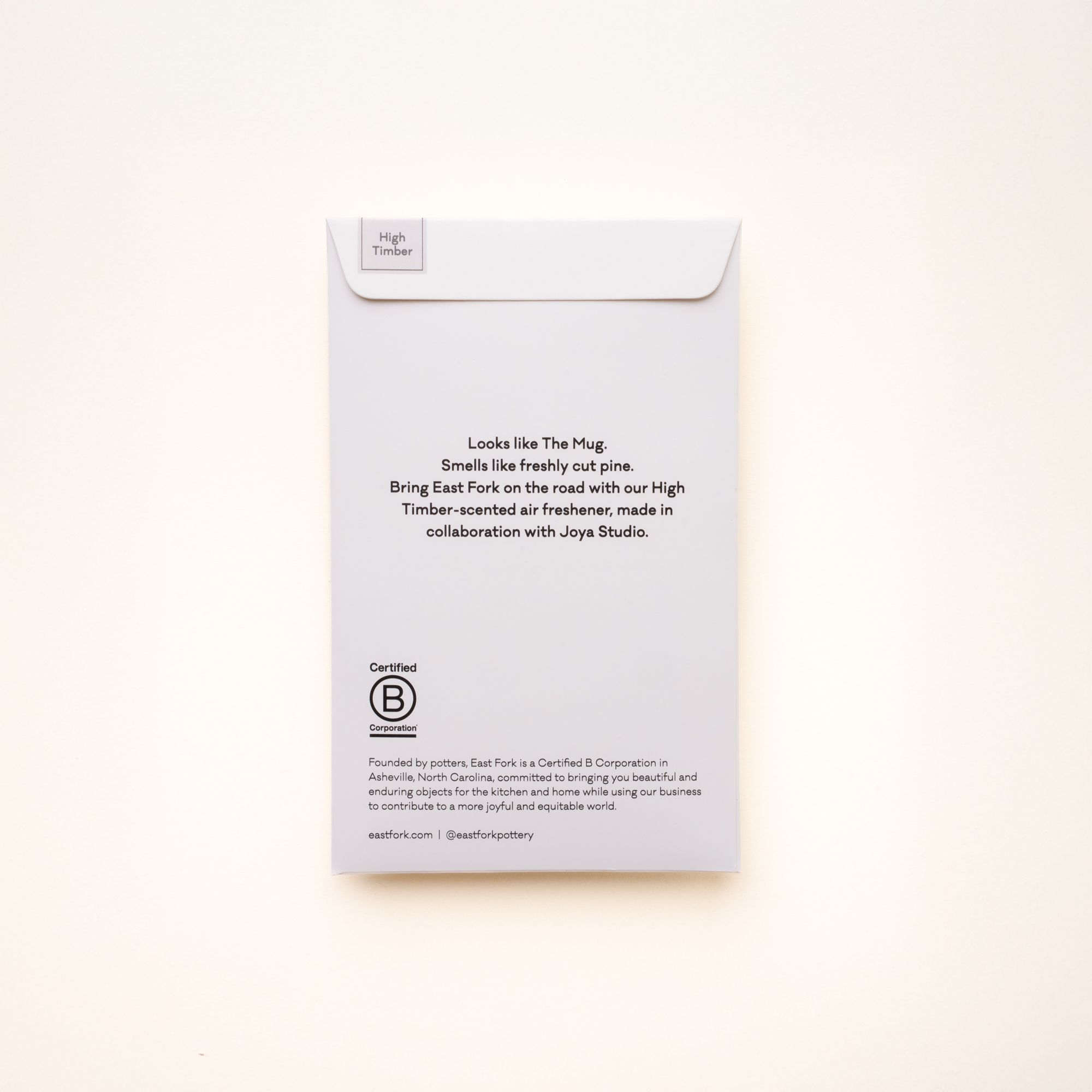 Back of East Fork “High Timber” air freshener packaging — describes the scent as “freshly cut pine” and highlights the Joya Studio collaboration and Certified B Corp status.