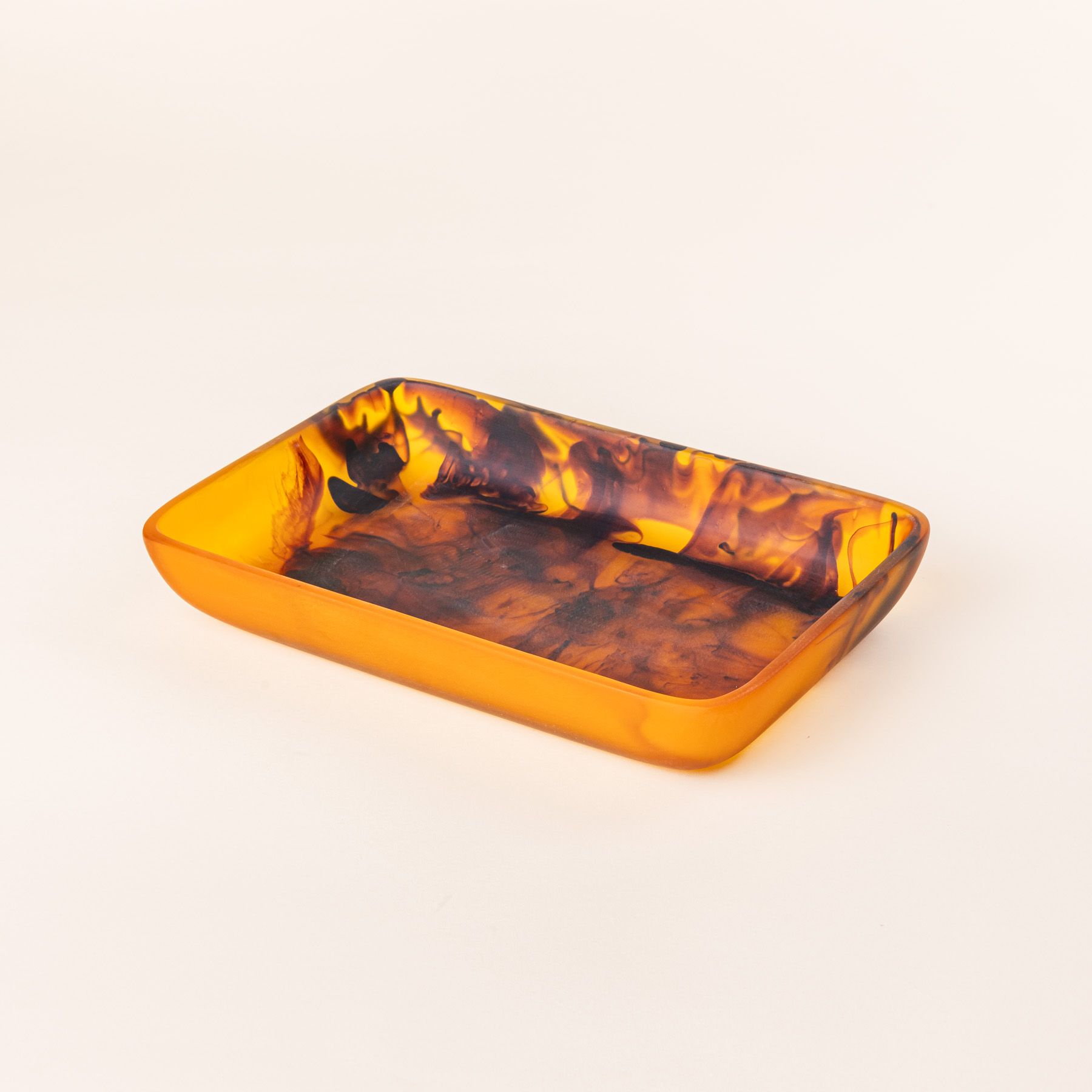 A rectangular tortoiseshell tray with curved corners