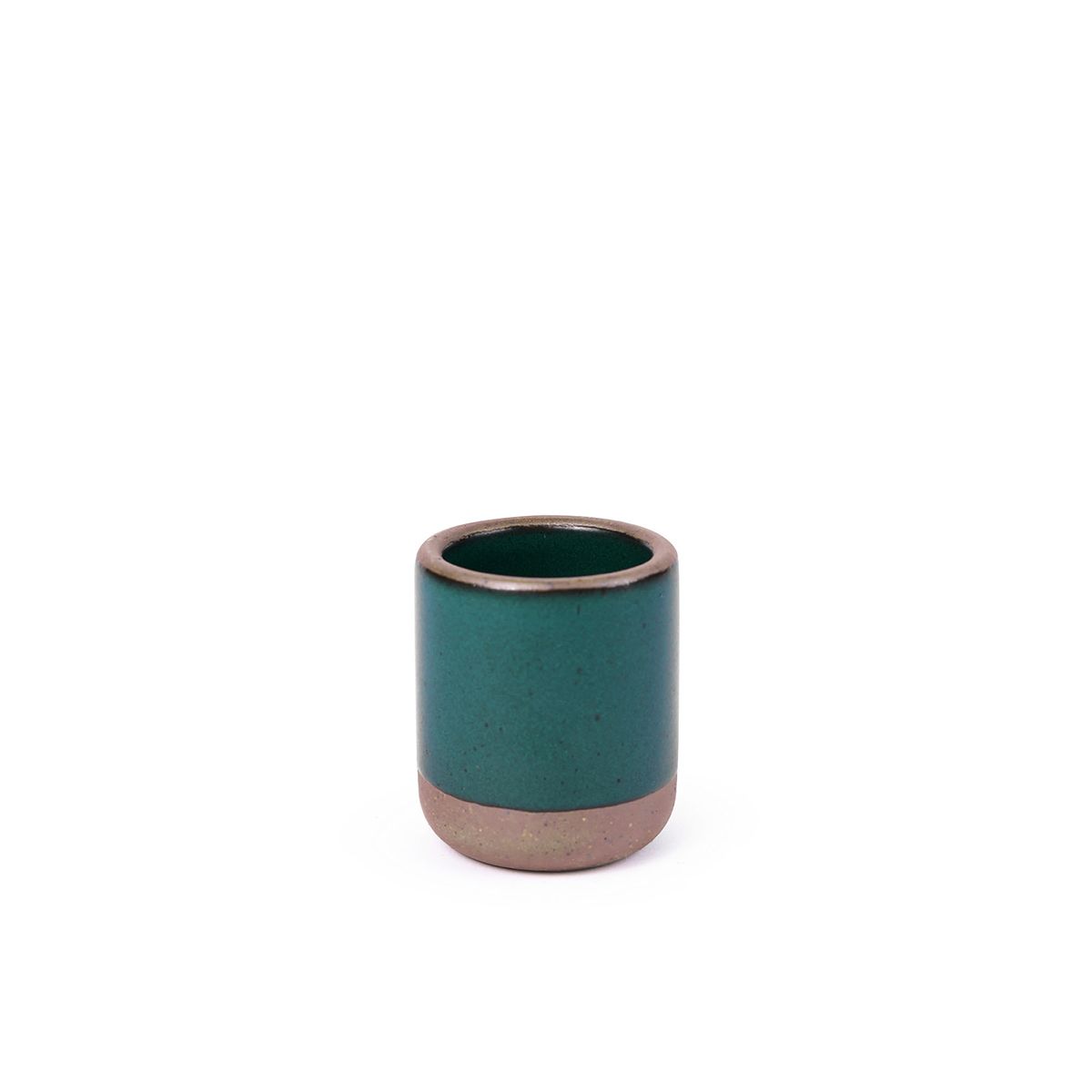 A small, short ceramic mug cup in a deep dark teal color featuring iron speckles and unglazed rim and bottom base.
