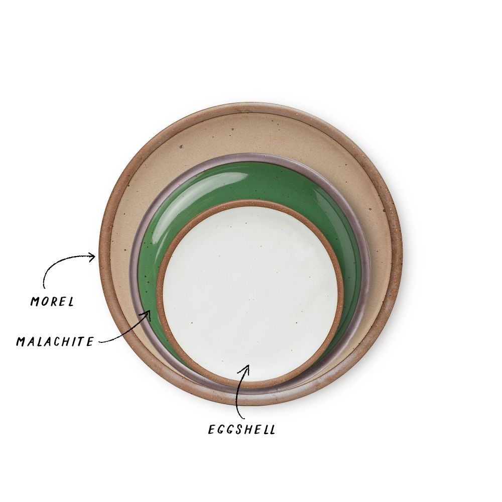 A stack of 3 plates in Dinner, Side, and Cake sizes in a warm pale brown, glossy emerald green, and cool white colors.