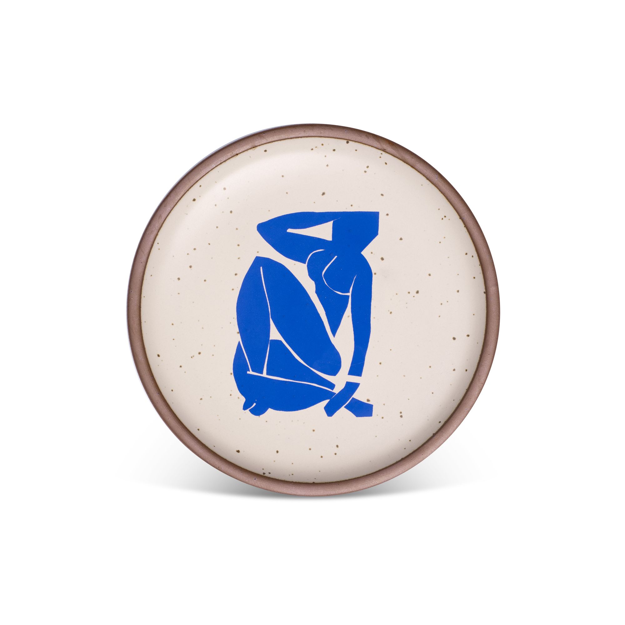 A bright blue, abstract, silhouetted female figure in a curled, seated position, with sharp cut-out edges, centered on an off-white ceramic plate with an unglazed rim.