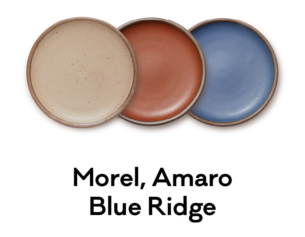 Three plates colored in a warm, earthy brown, a terra cotta red and a denim-like blue are positioned next to each other. Underneath, text reads: "Morel, Amaro, Blue Ridge"