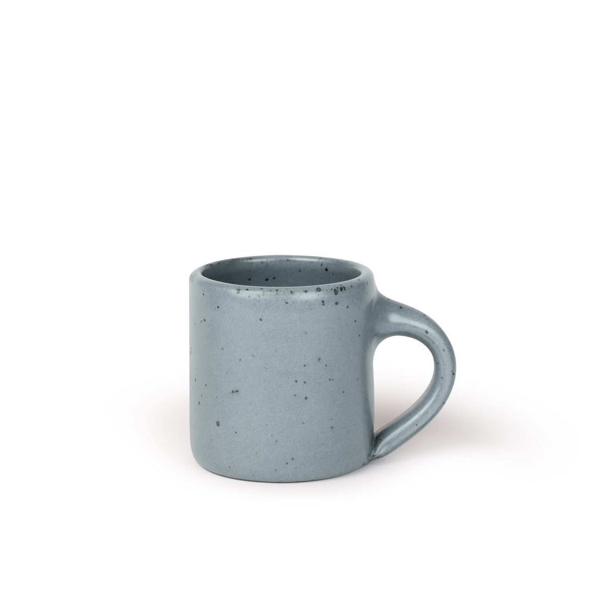 A medium sized ceramic mug with handle in a light blue-grey color featuring iron speckles