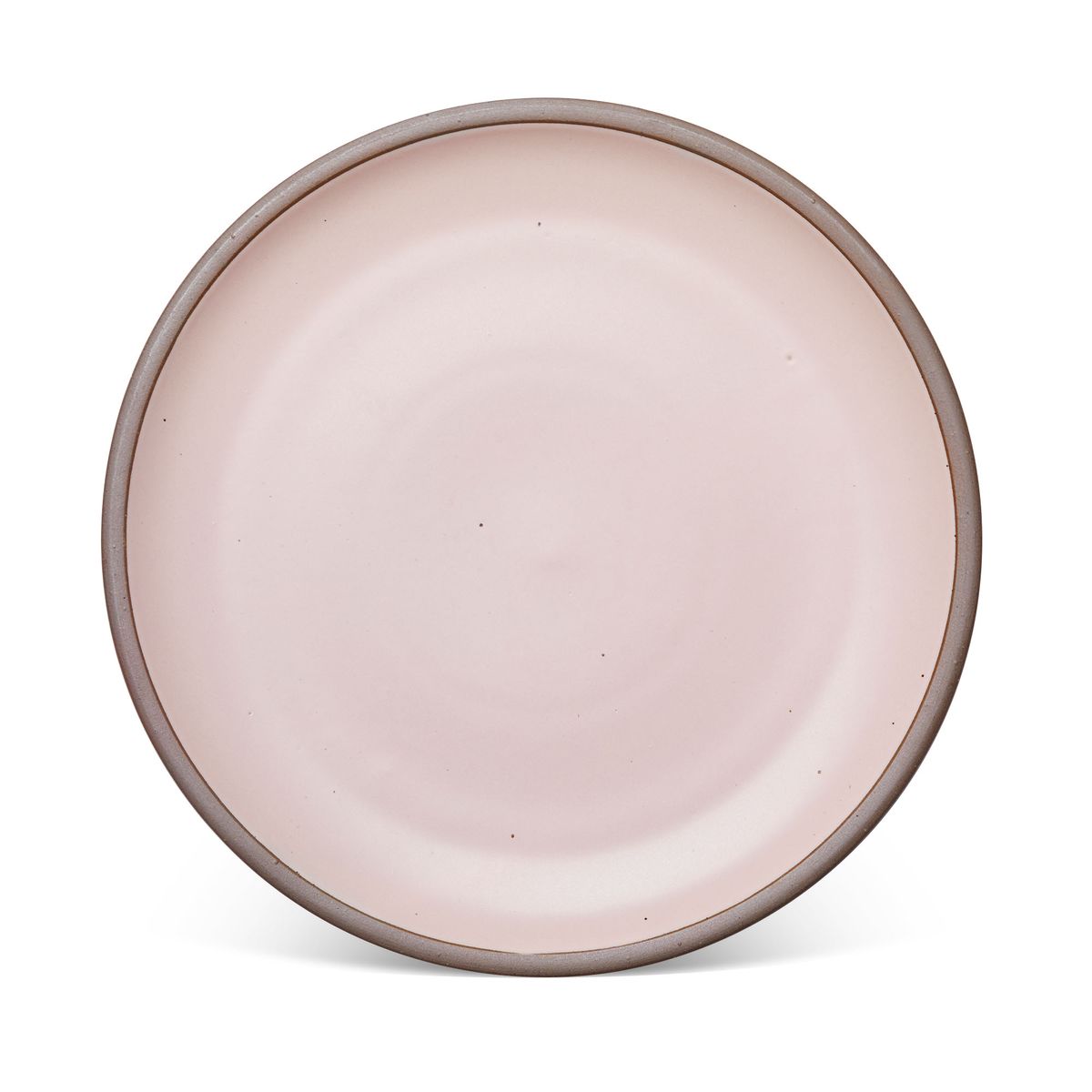 A large ceramic platter in a soft light pink color featuring iron speckles and an unglazed rim