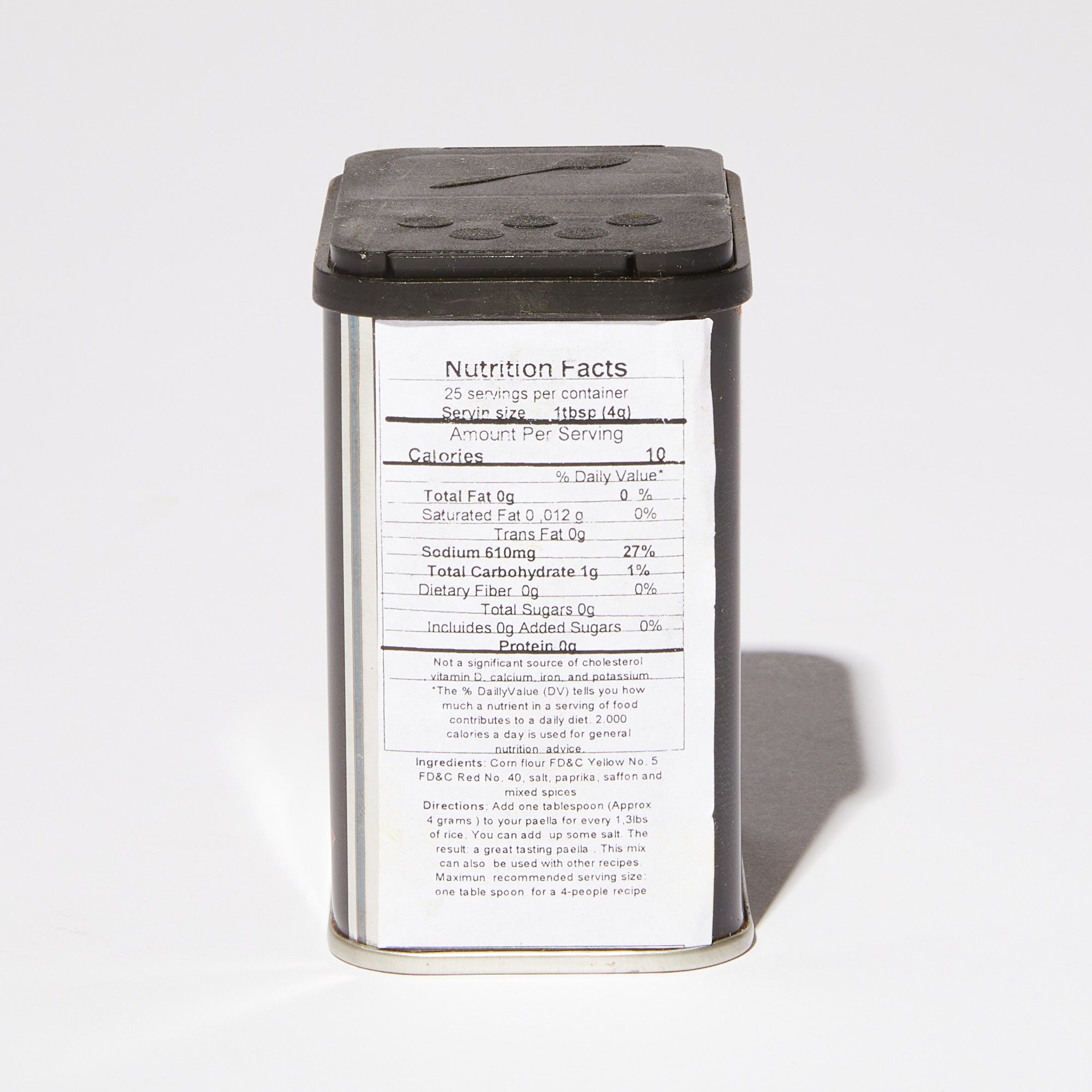 The back of a black tin of paella spices featuring nutritional facts